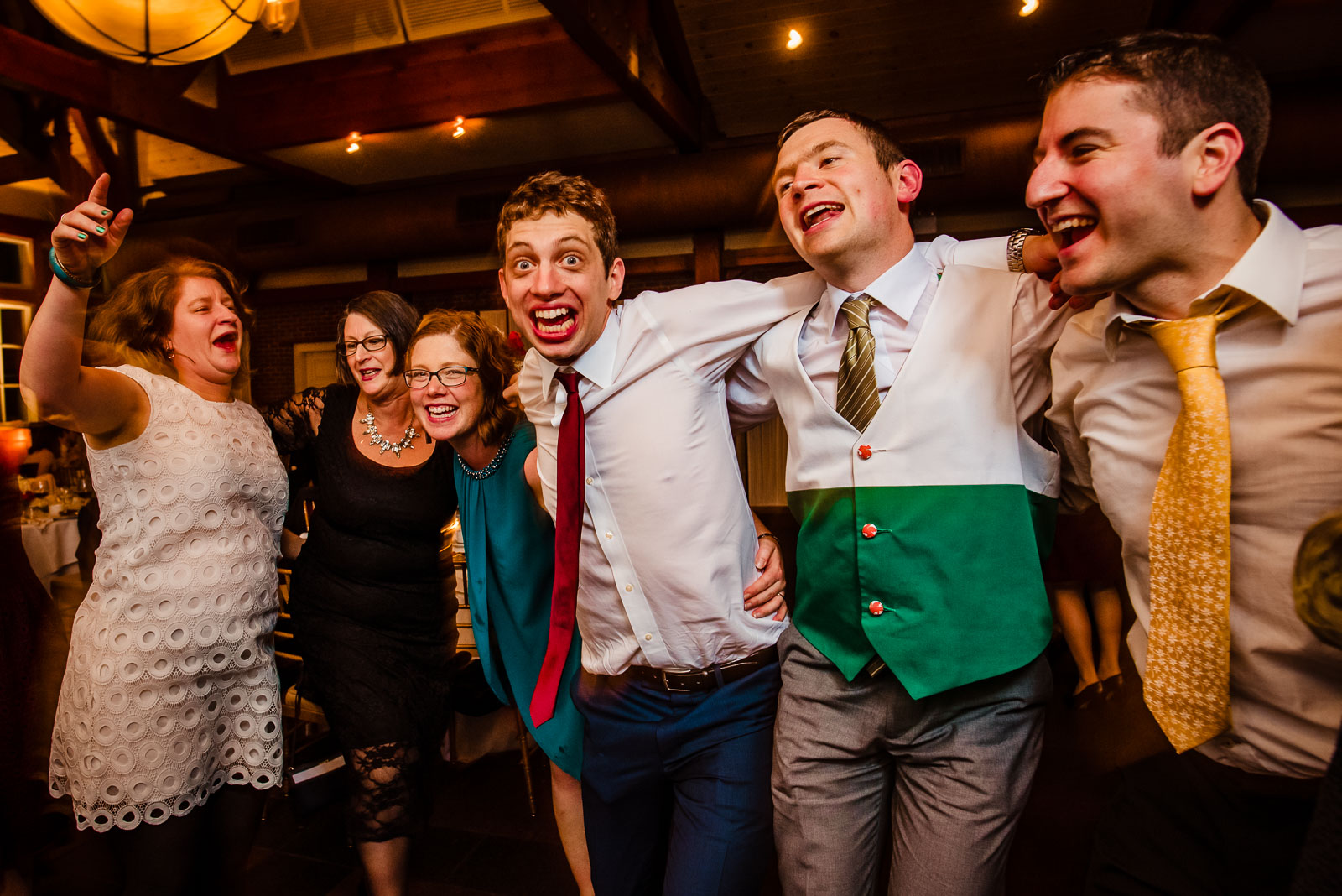 Groom dances with guests