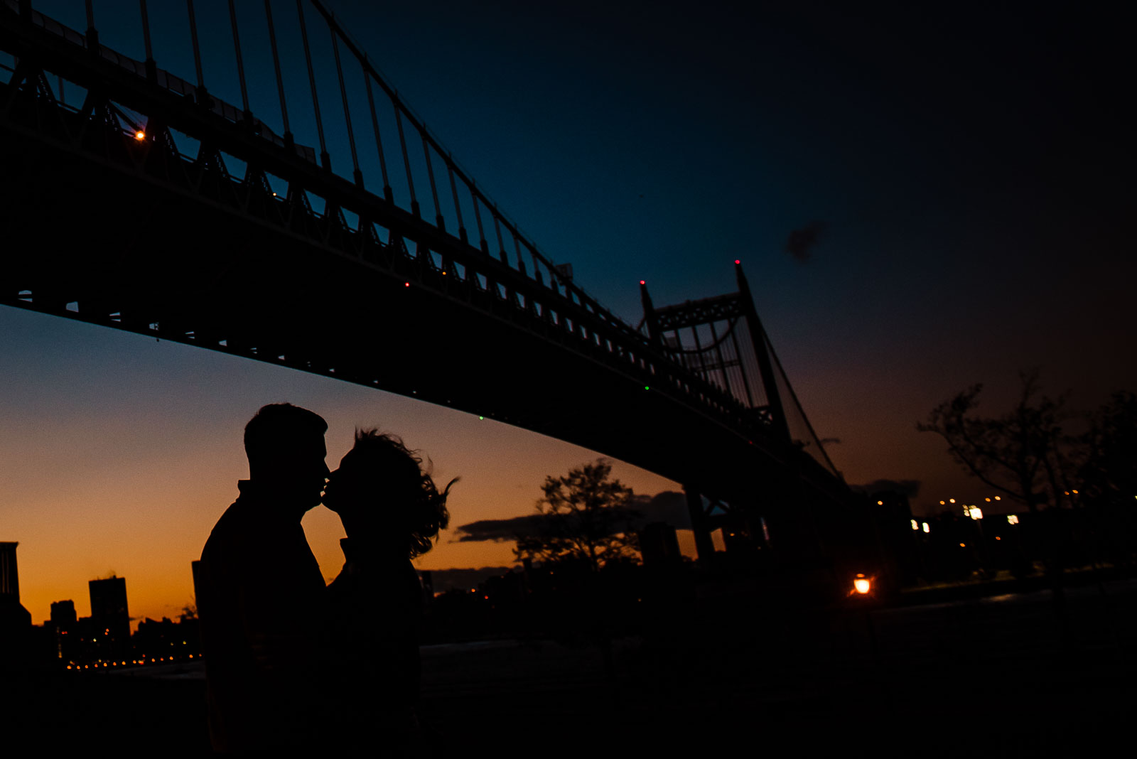 Couple's portrait with bridge