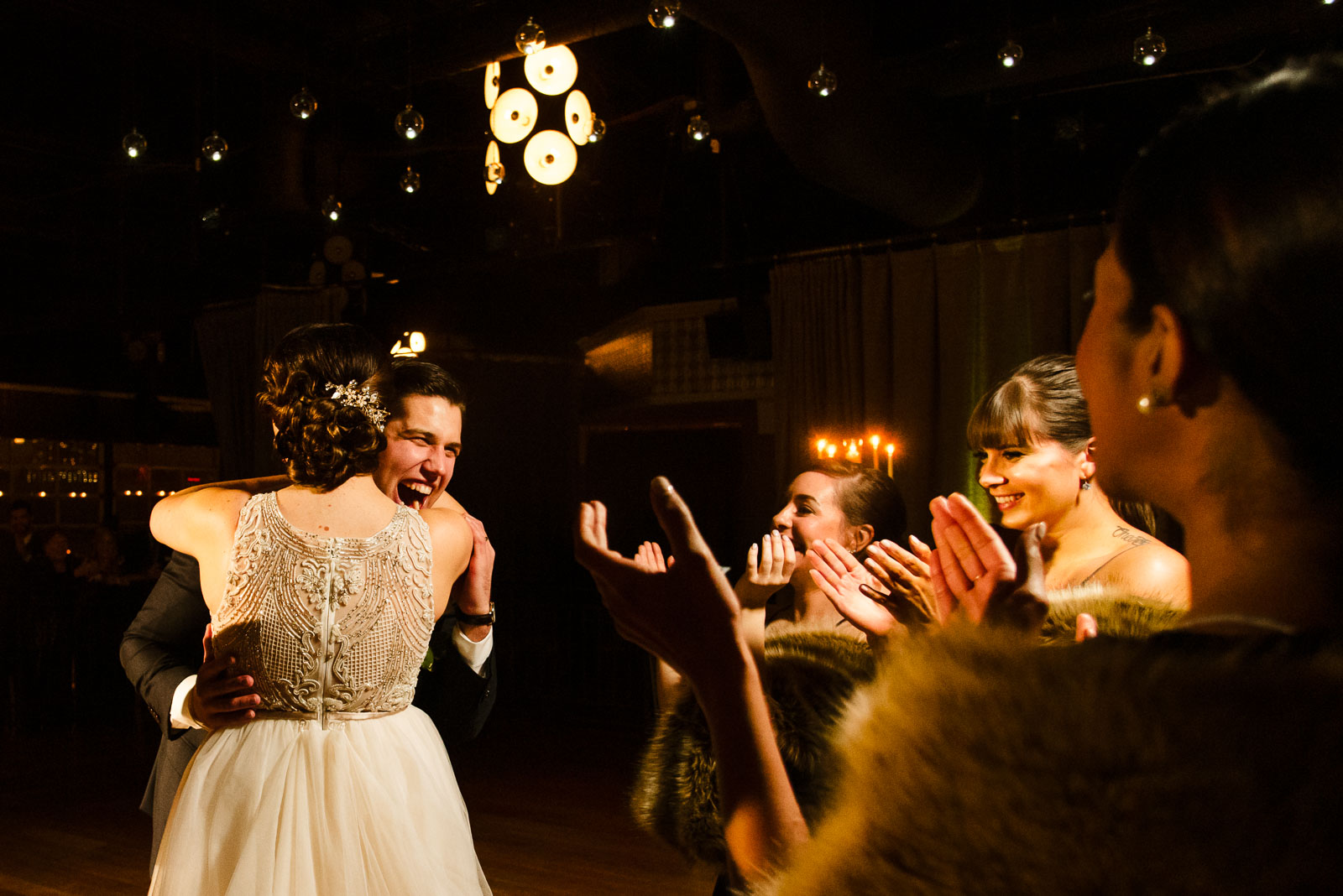 Bride and groom hug