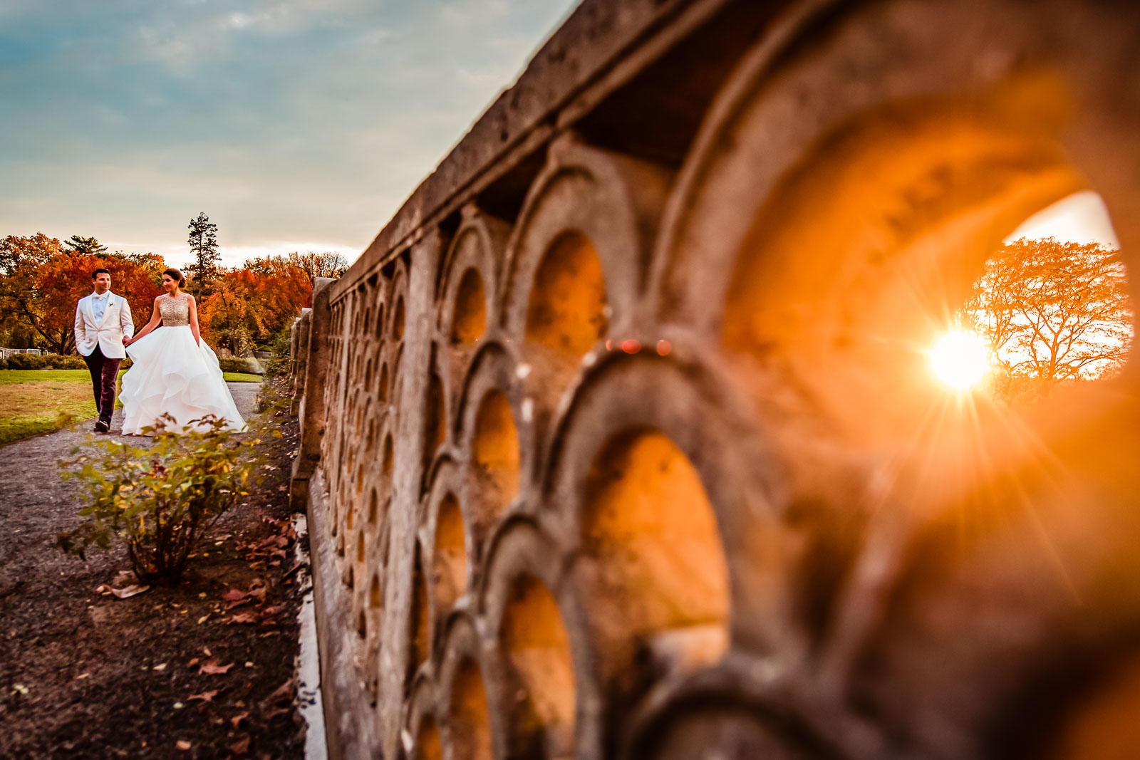 Bride and groom sunset walk