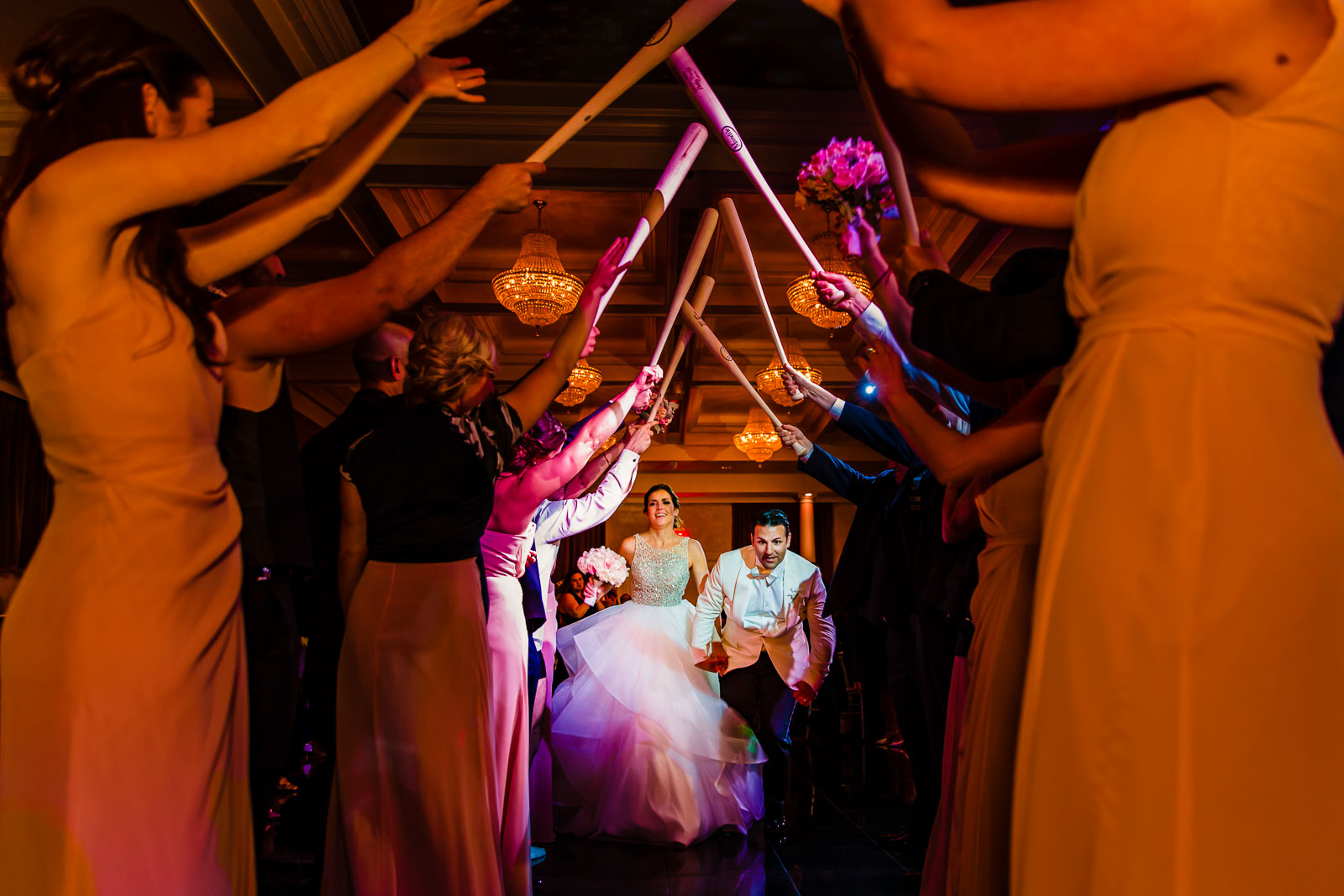 Bride and groom run in tunnel