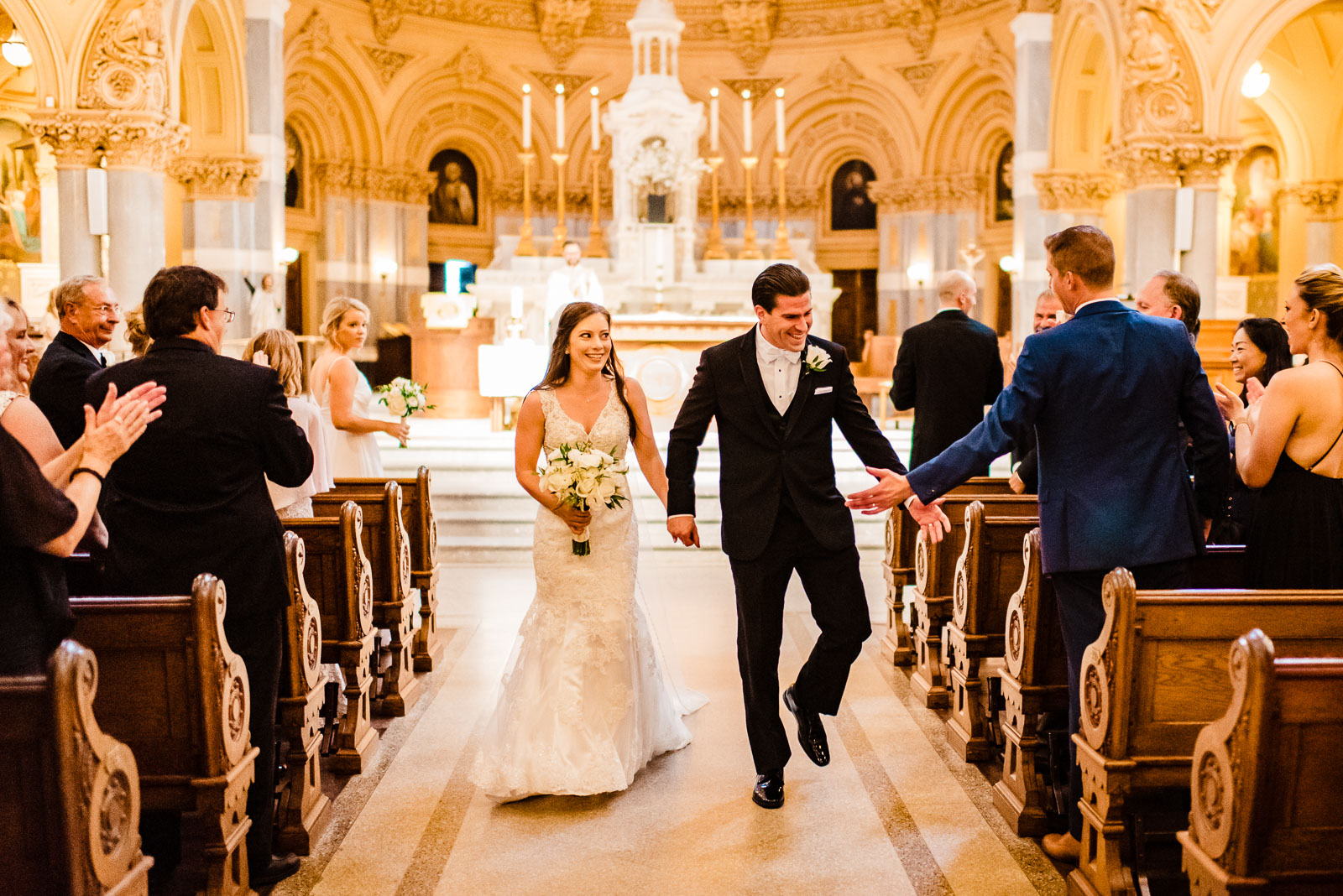 Bride and groom walk after ceremony