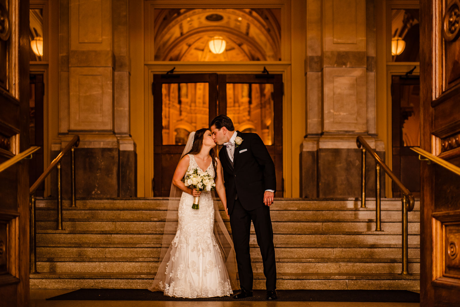 Bride and groom kiss after church ceremony