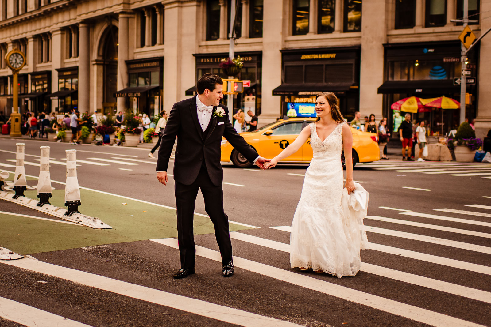 Bride and groom walk on NYC streets