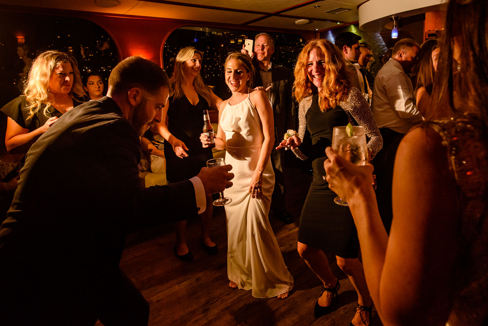 Guests dance during reception