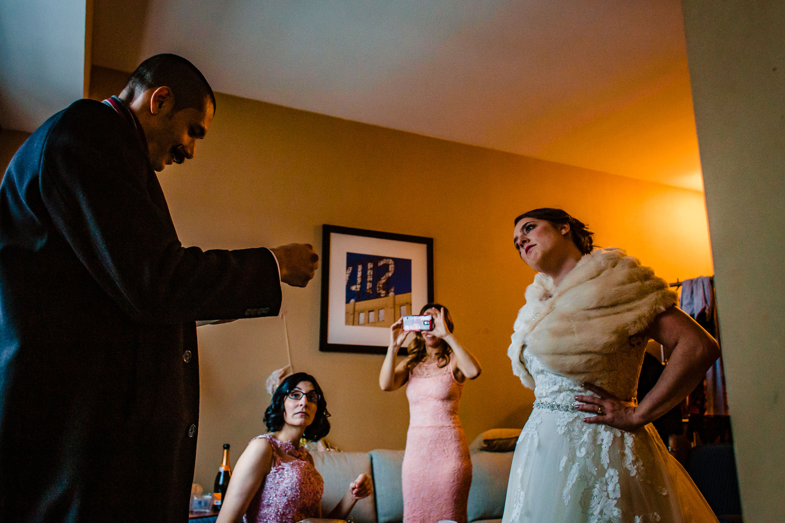 Bride and groom get ready in hotel