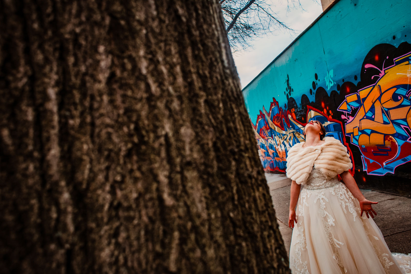 Bride looks up at sky