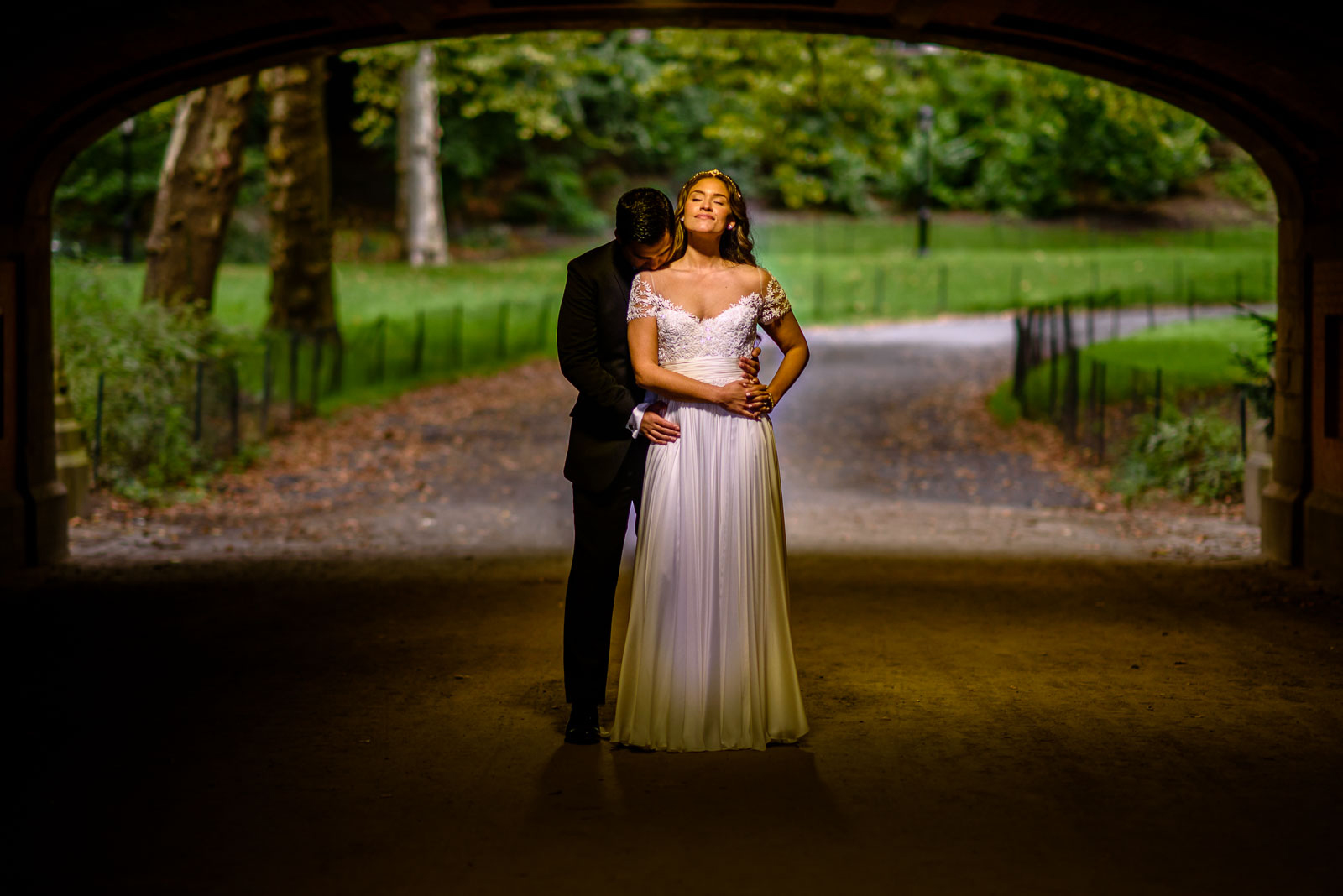 Brdie and groom portrait in tunnel 