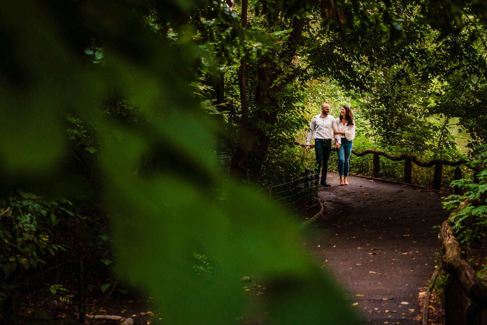 Couple strolls in alley in Central Park