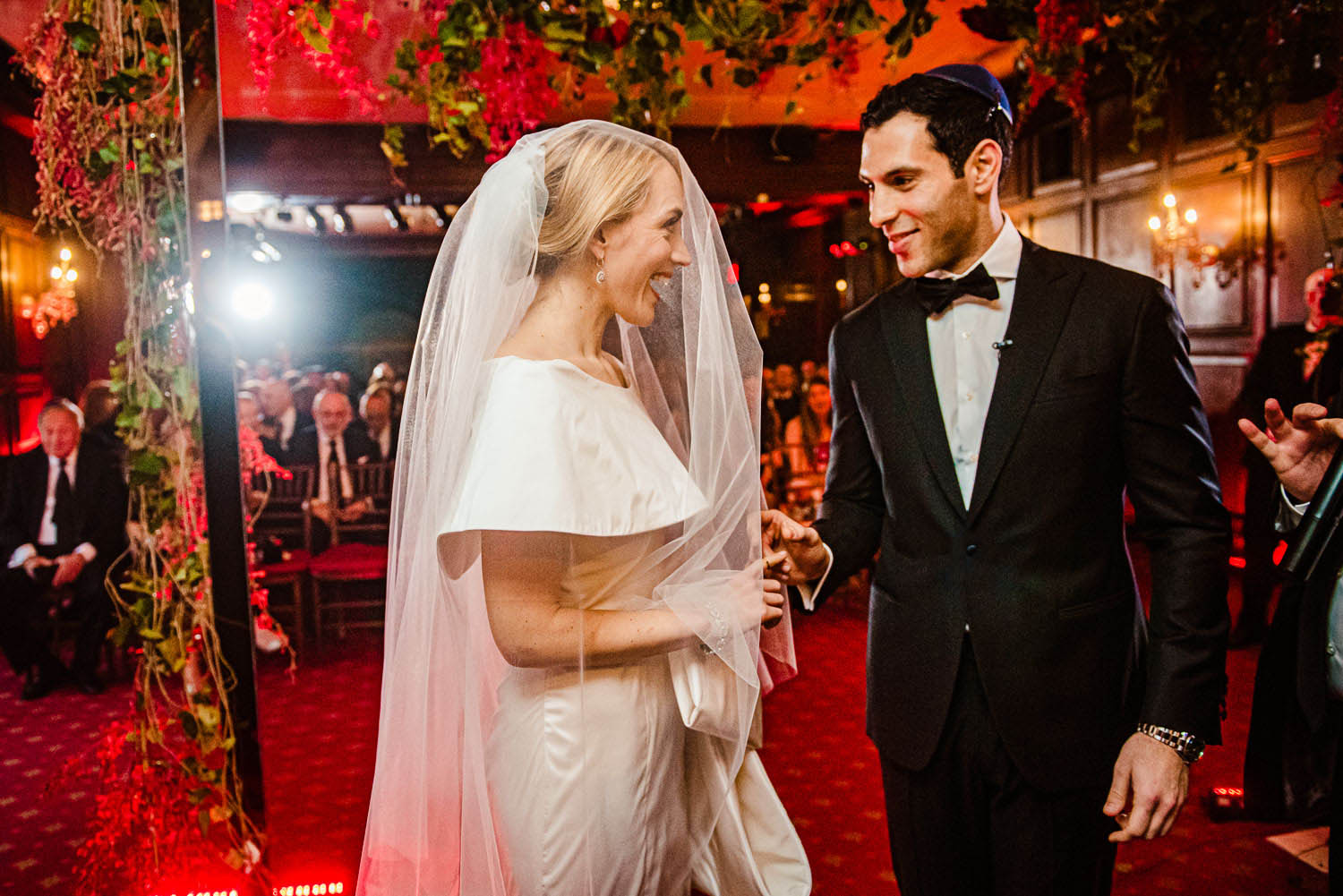 Bride and groom exchange rings during ceremony