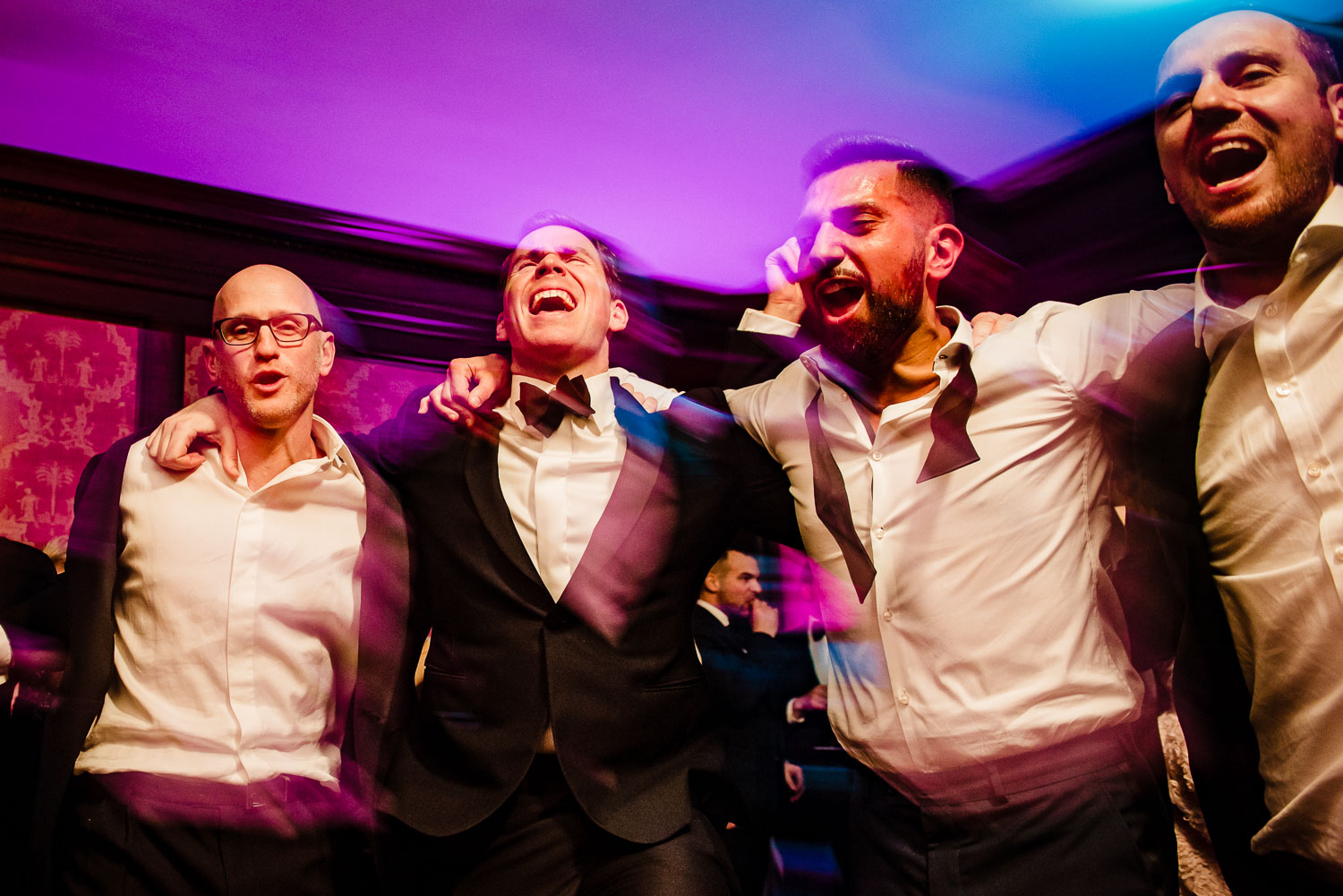 Groomsmen dance during reception