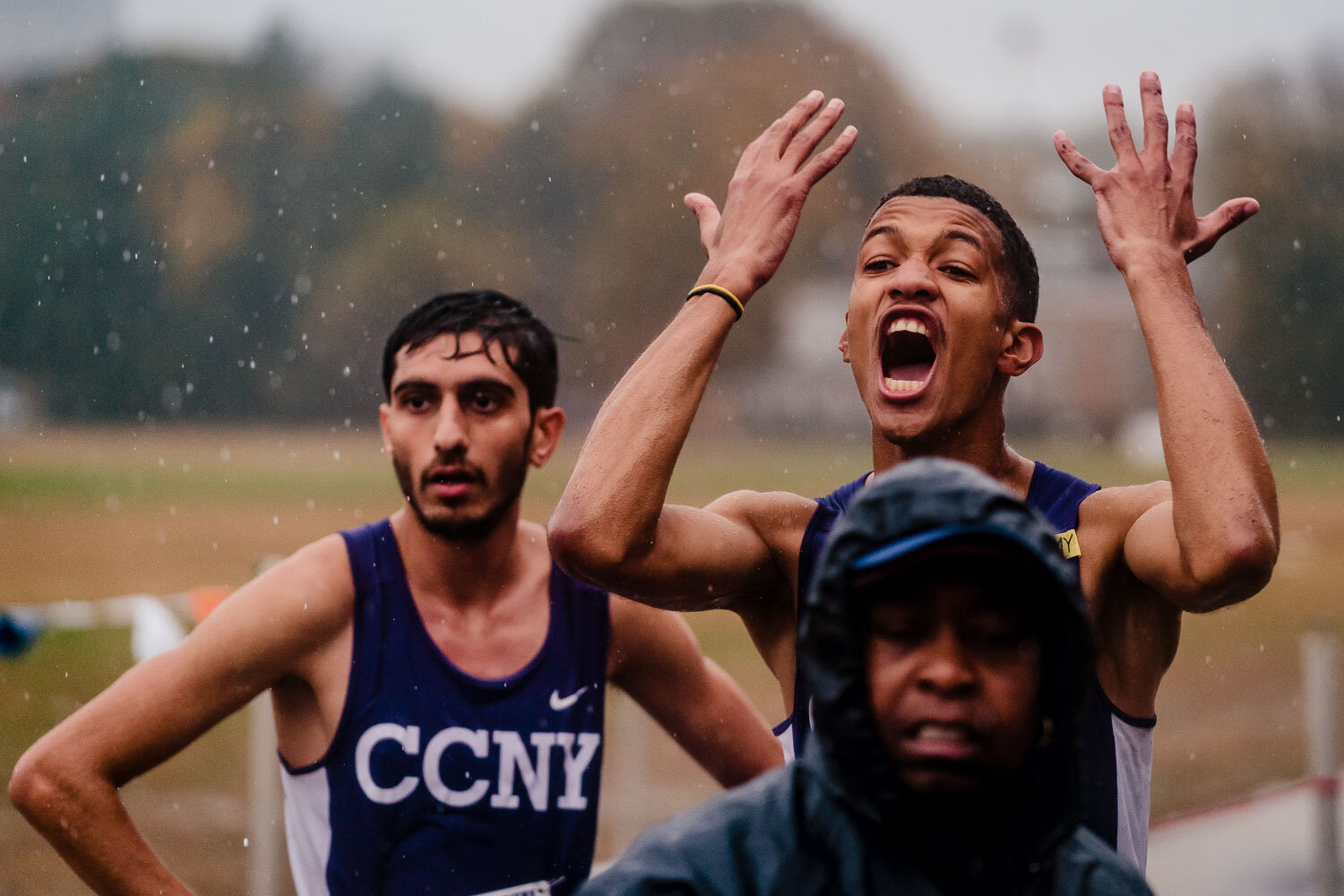 CCNY runner cheer for teammate during CUNYAC Championship race at van cortlandt park