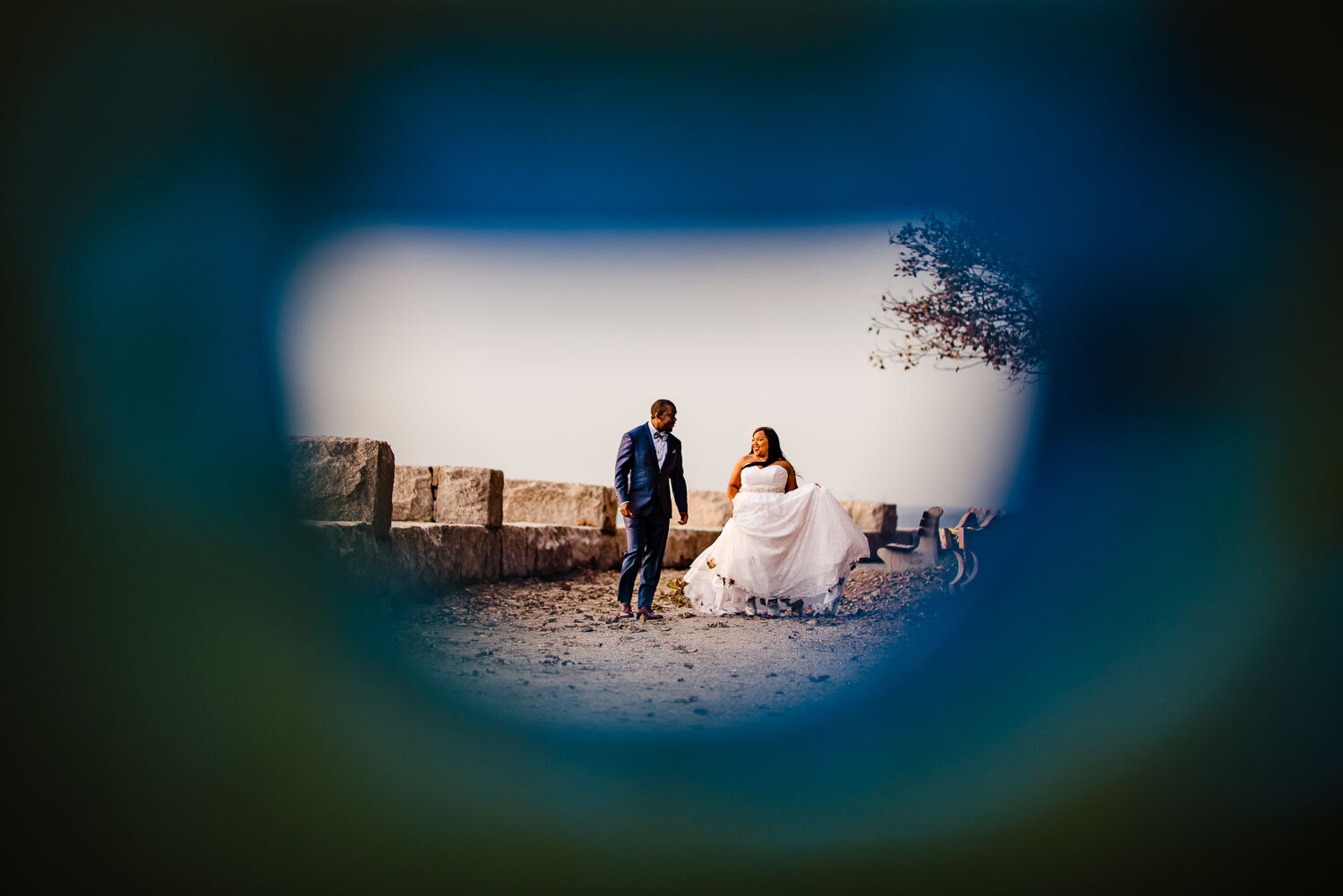 Bride and groom having fun in Morgan Memorial Park in Glen Cove 