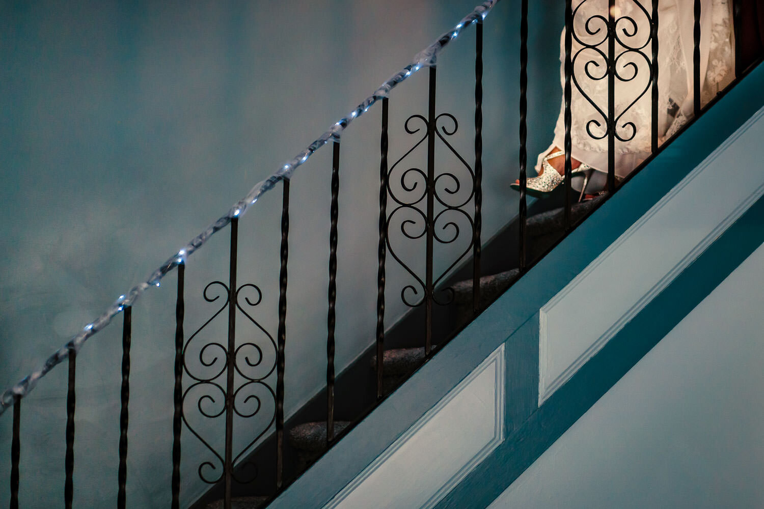 Bride appears on the steps of the stairs in her house