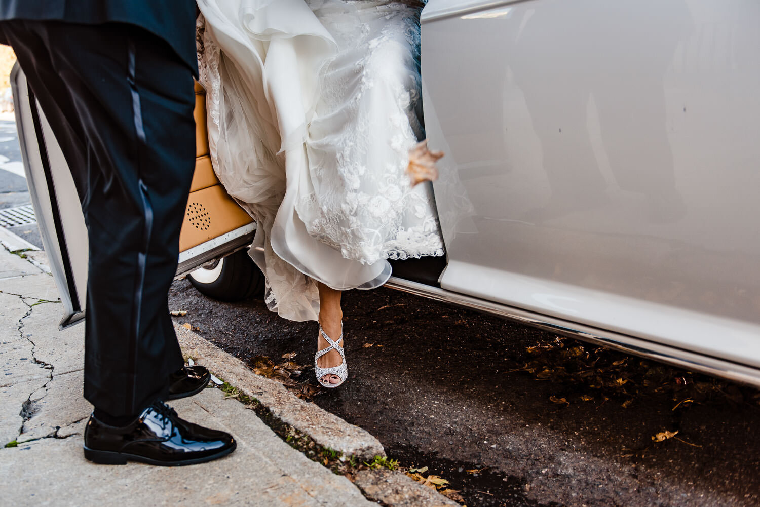 Bride steps out from the limo arriving at St. Margaret Catholic 