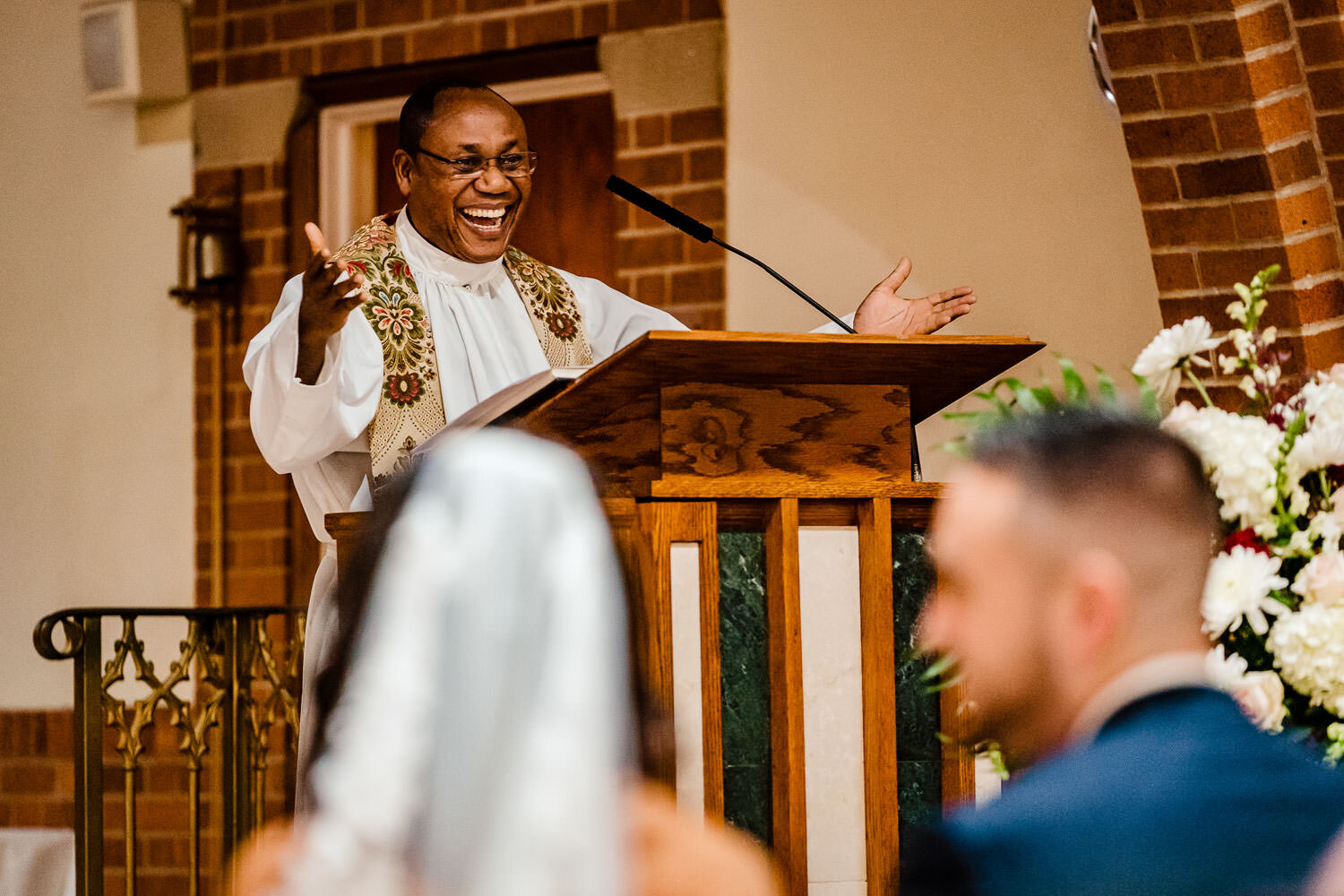 Priest during the ceremony at St. Margaret Catholic School in Qu