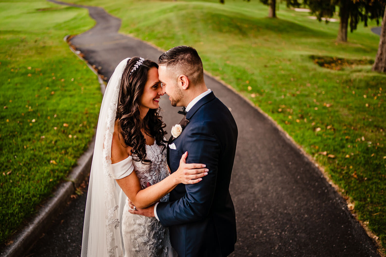Bride and groom portrait on a golf course path at Royalton on the Greens in Melville on Long Island