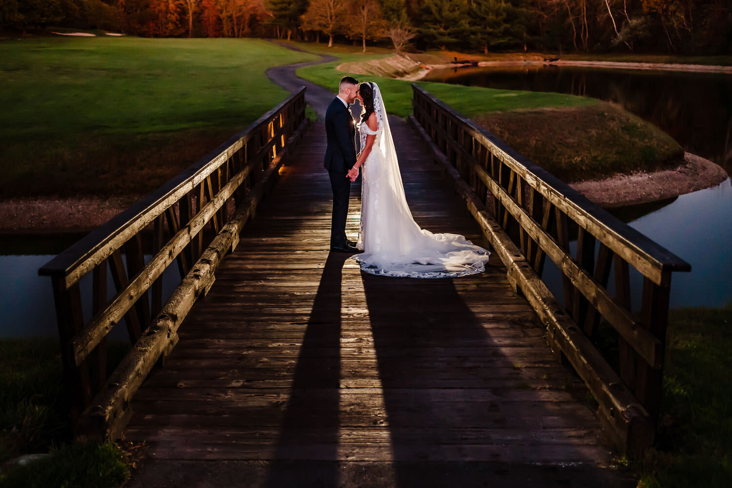 Bride and groom portrait on the bridge at Royalton on the Greens