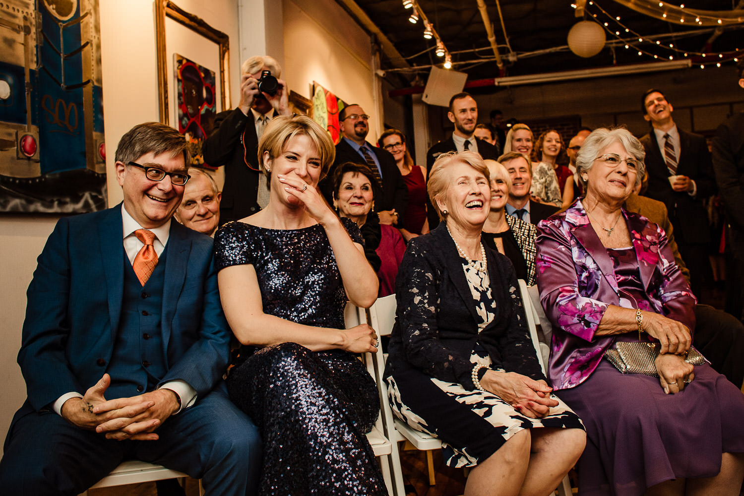 Parents reaction during ceremony at Aurora Gallery in Long Island City