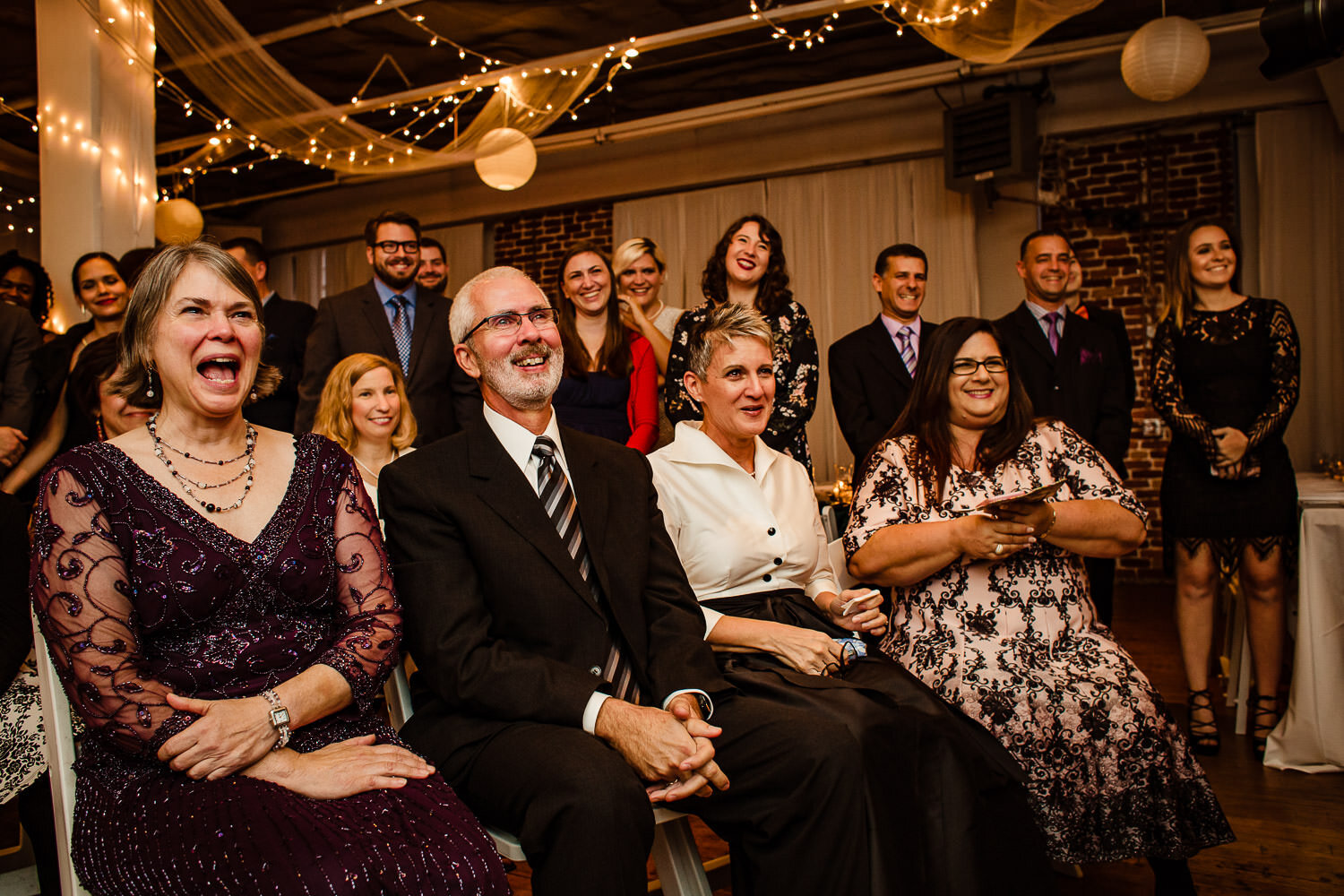 Parents reaction during ceremony at Aurora Gallery in Long Island City