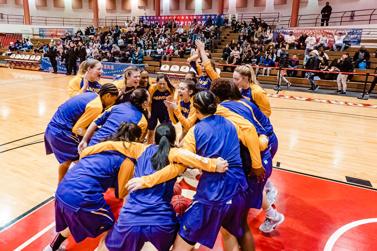 Hunter women's basketball team huddle before the game against Brooklyn during CUNYAC Championship at York College 