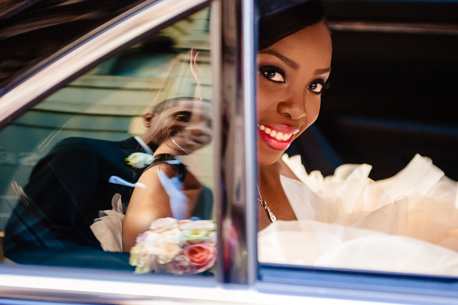 Bride and groom limo reflection