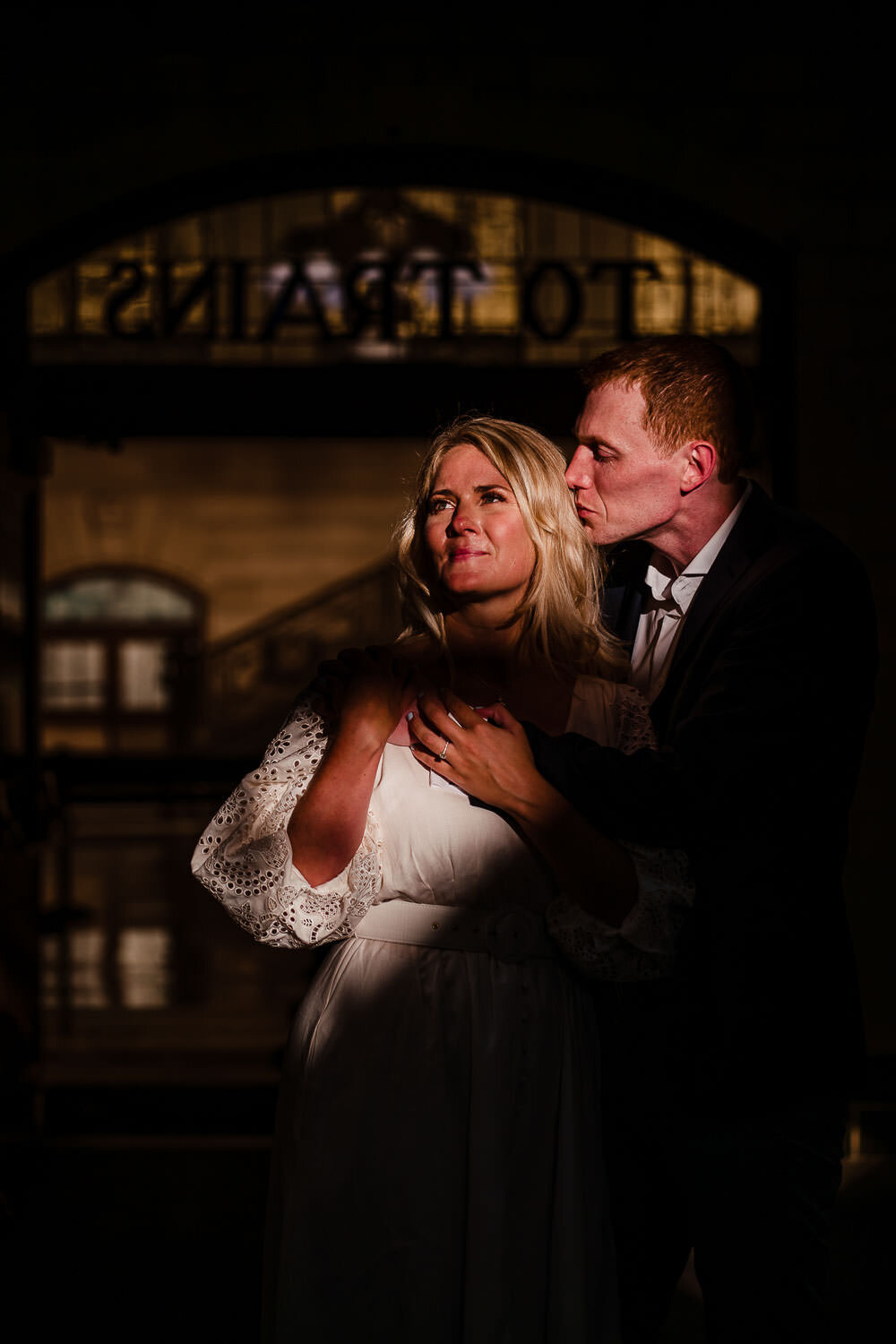 Couple's portrait at Hoboken train station waiting area