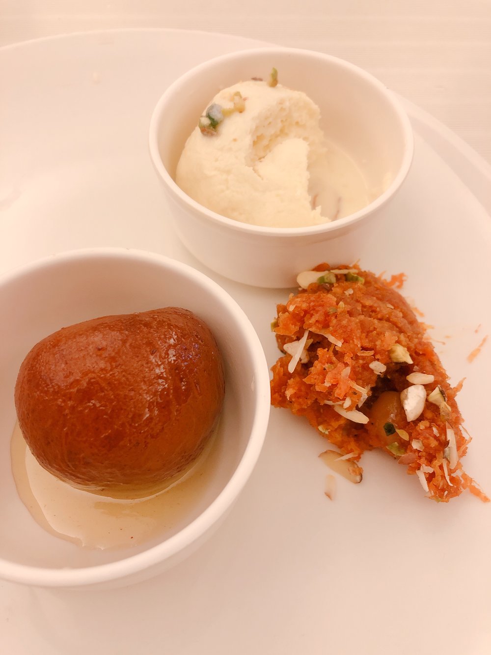  Dessert!! Top: kesari rasmalai, a  bready dumpling. Left: gulab jamun, a sugar syrup fried dumpling. Right: gajar halwa, grated carrots and nuts. 