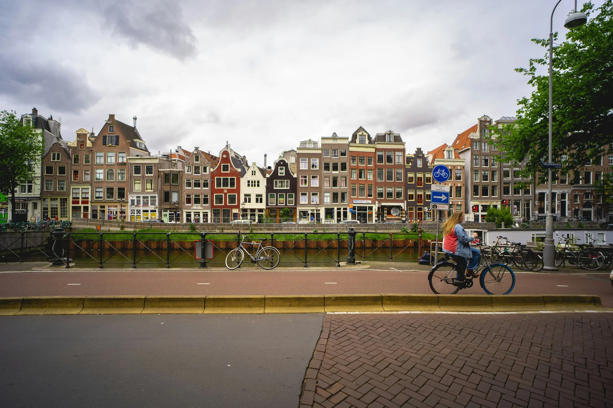person biking in amsterdam