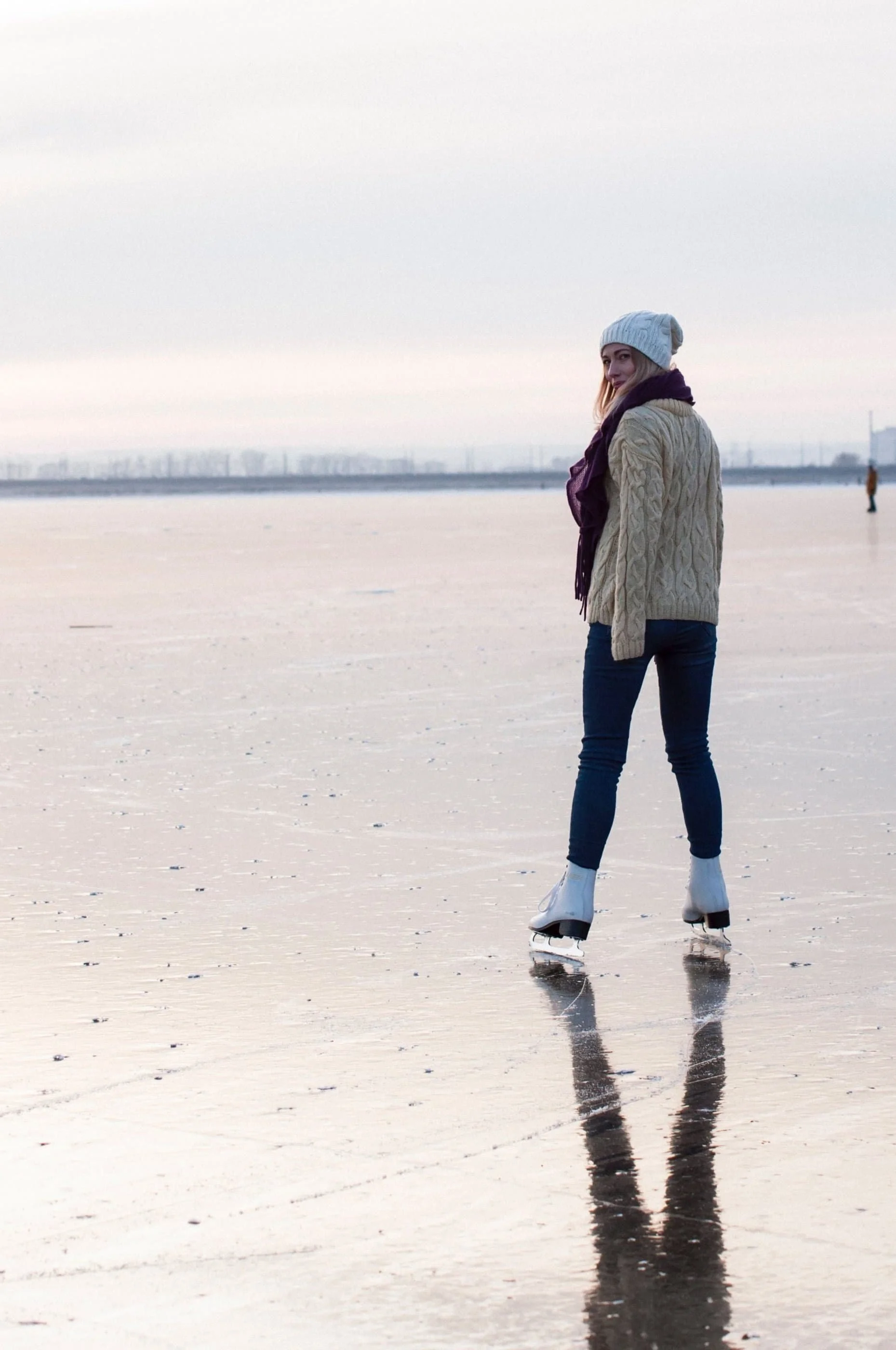 woman ice skating on lake