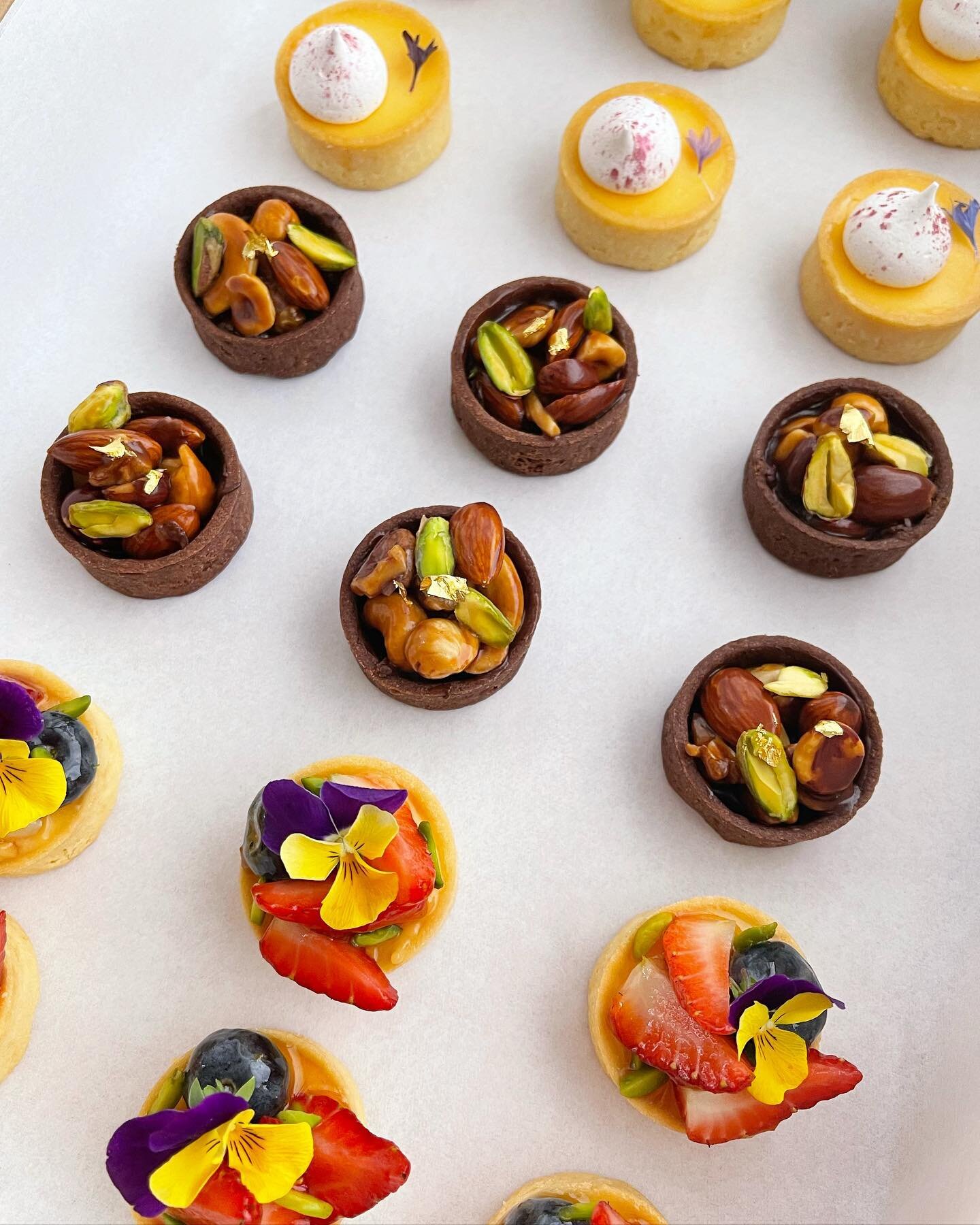 MINI DELICIOUSNESS: because sometimes good things come in mini sizes!

Our tart selection featured here hits the sweet spot with seasonal fruit &amp; custard, assorted caramel nuts &amp; lemon curd with meringue kisses. 

Which one would you choose f