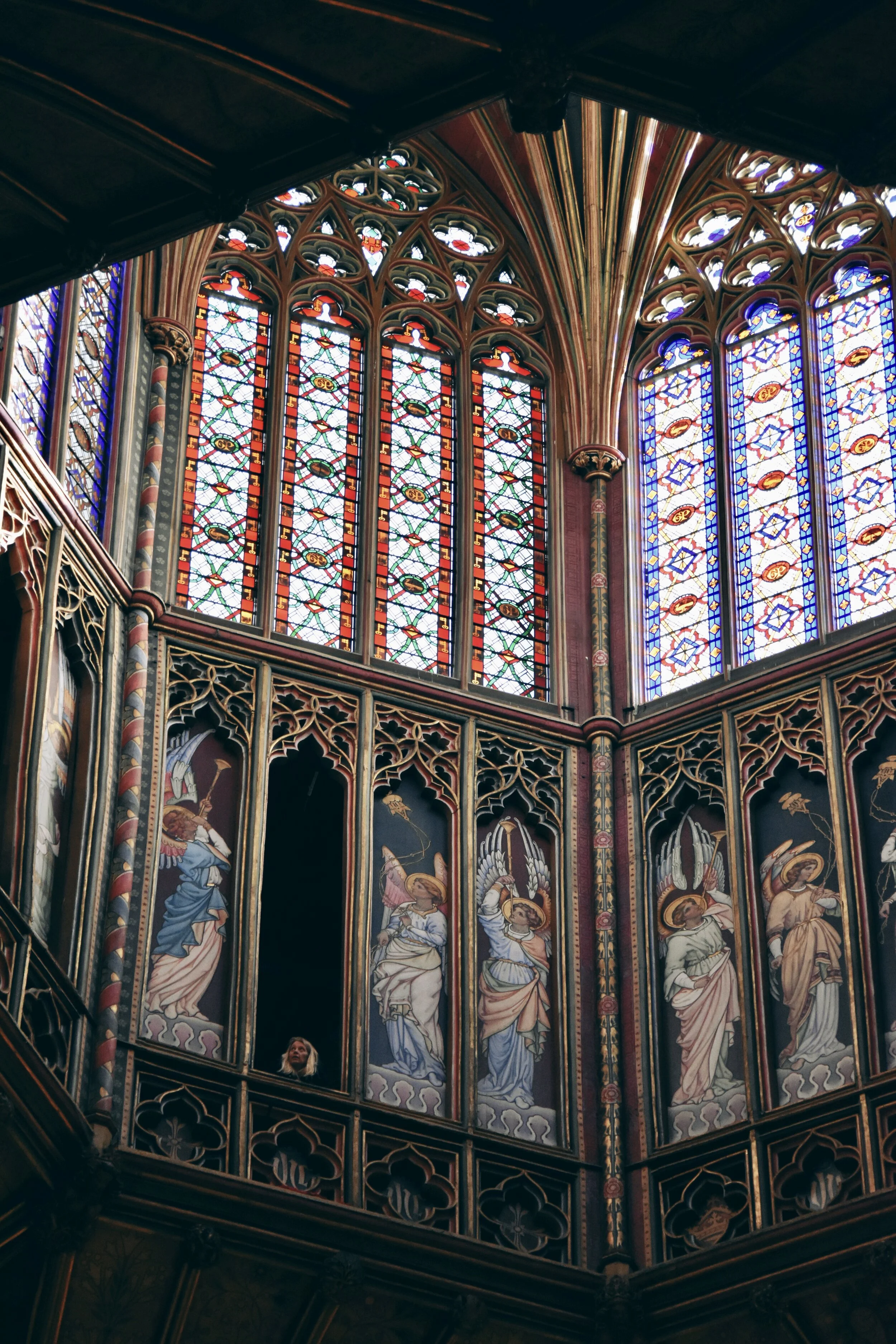  Woman peeking out of the Octagon angel panels at Ely Cathedral in Ely, Cambridgeshire, England (February 1, 2020) 