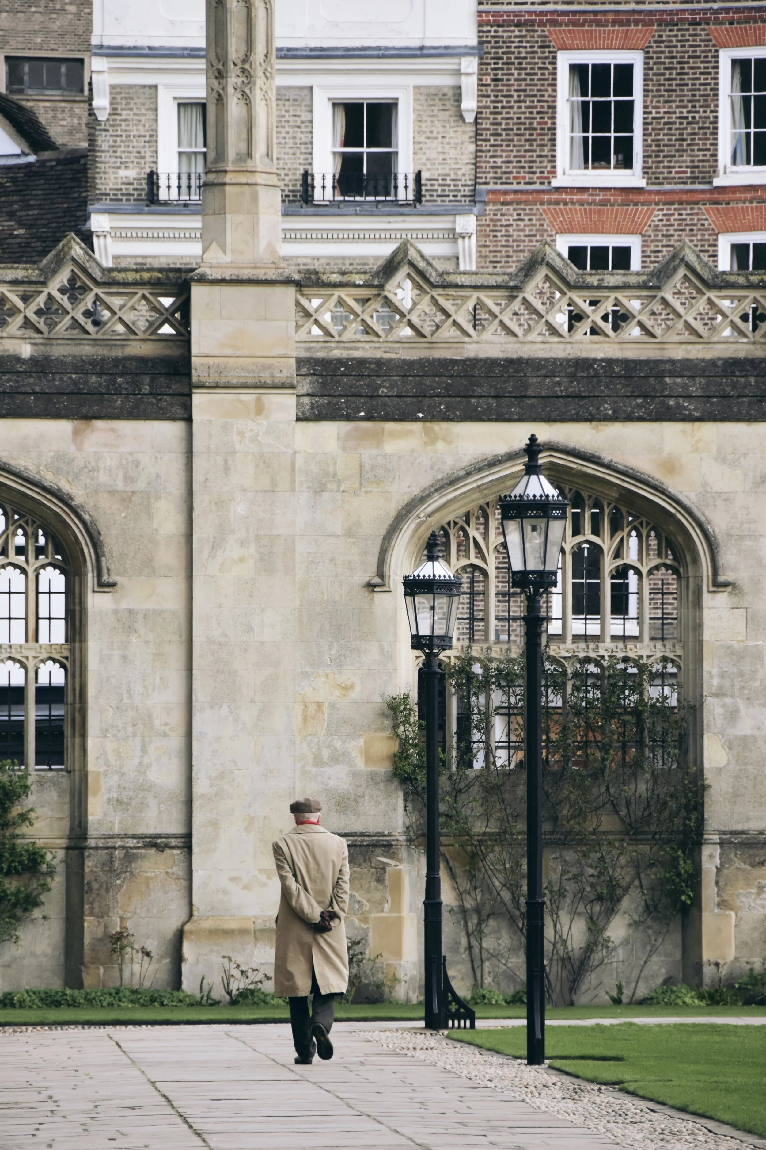  Man walking in Front Court of King’s College in Cambridge, England (March 20, 2020) 