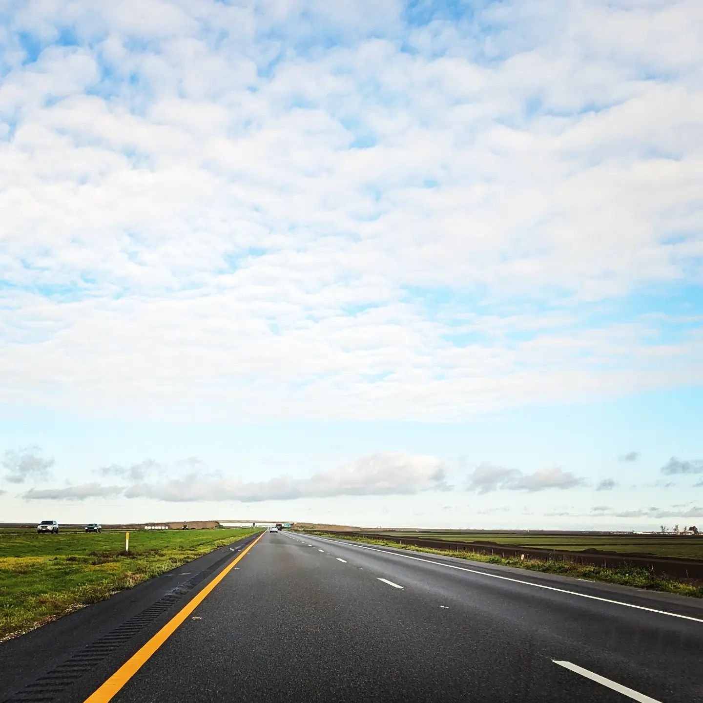 This is me being a bad driver - taking a picture of the unusually green open road on the I-5 after excitiedly driving through a moving storm because the generous and great poet Gary Young asked that I visit his poetry class at UC Santa Cruz, allowing