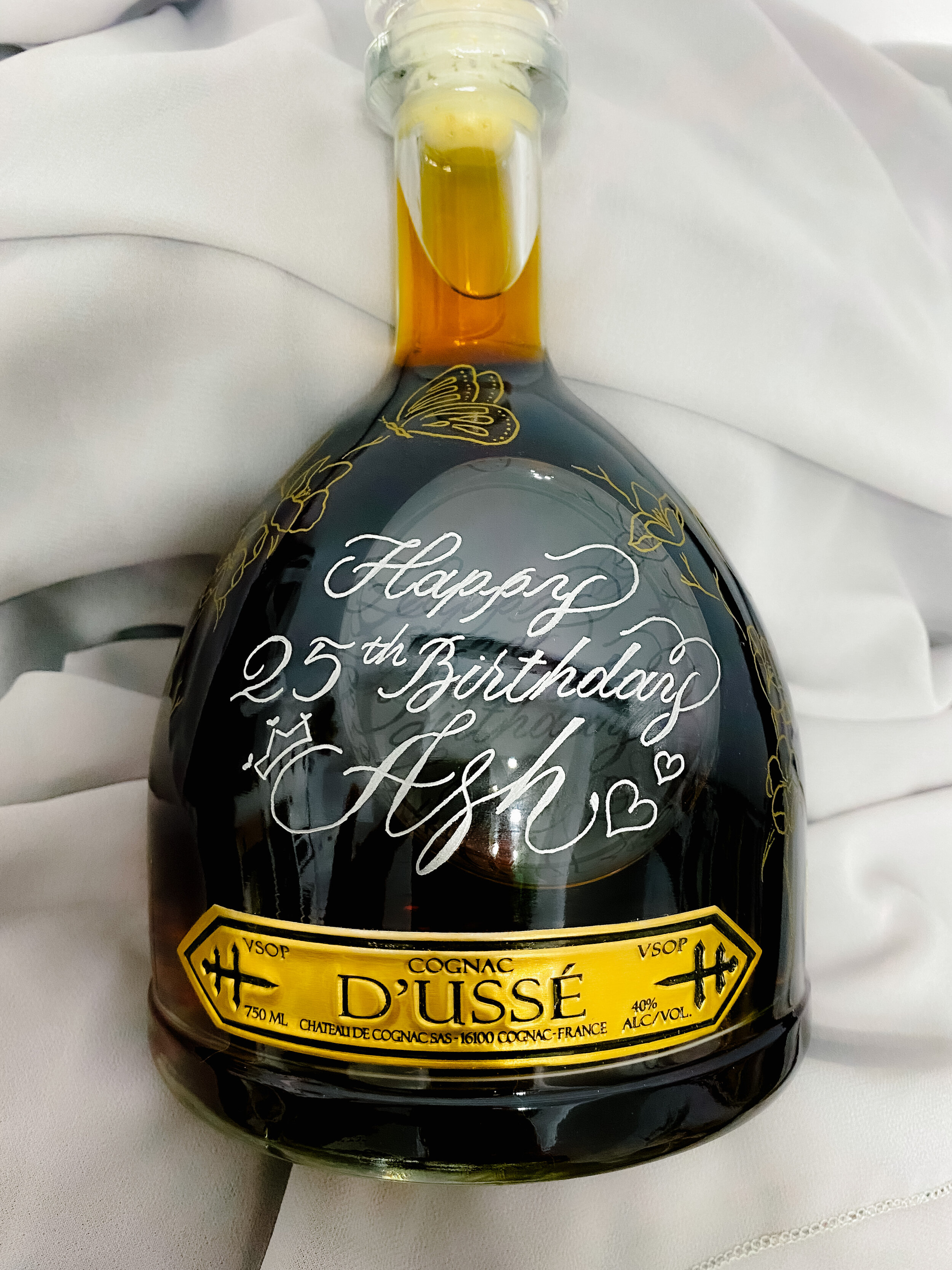 Calligraphy and Illustrative Engraving on a bottle