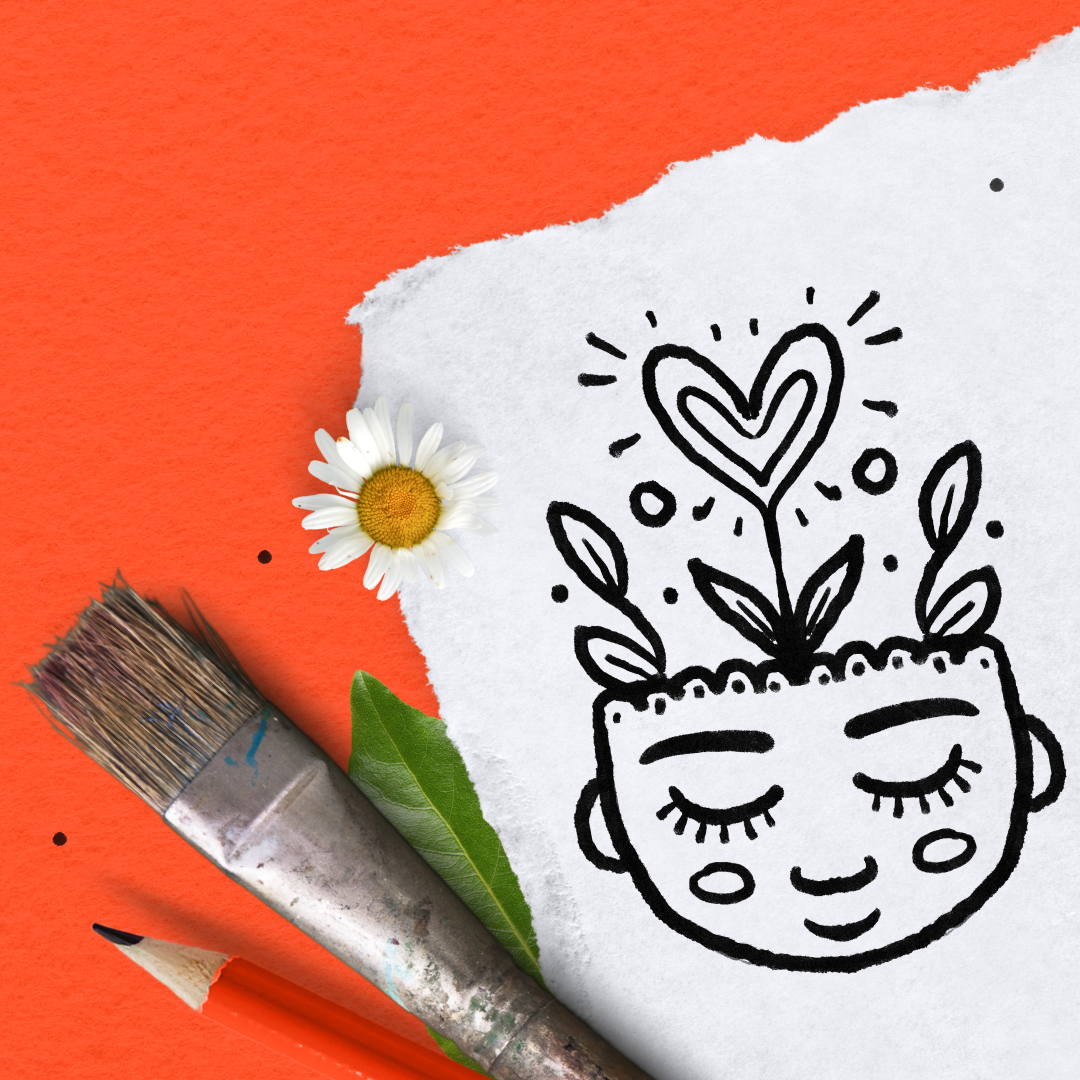Color pencil, paint brush, green leaf, flower, and a drawing on white paper