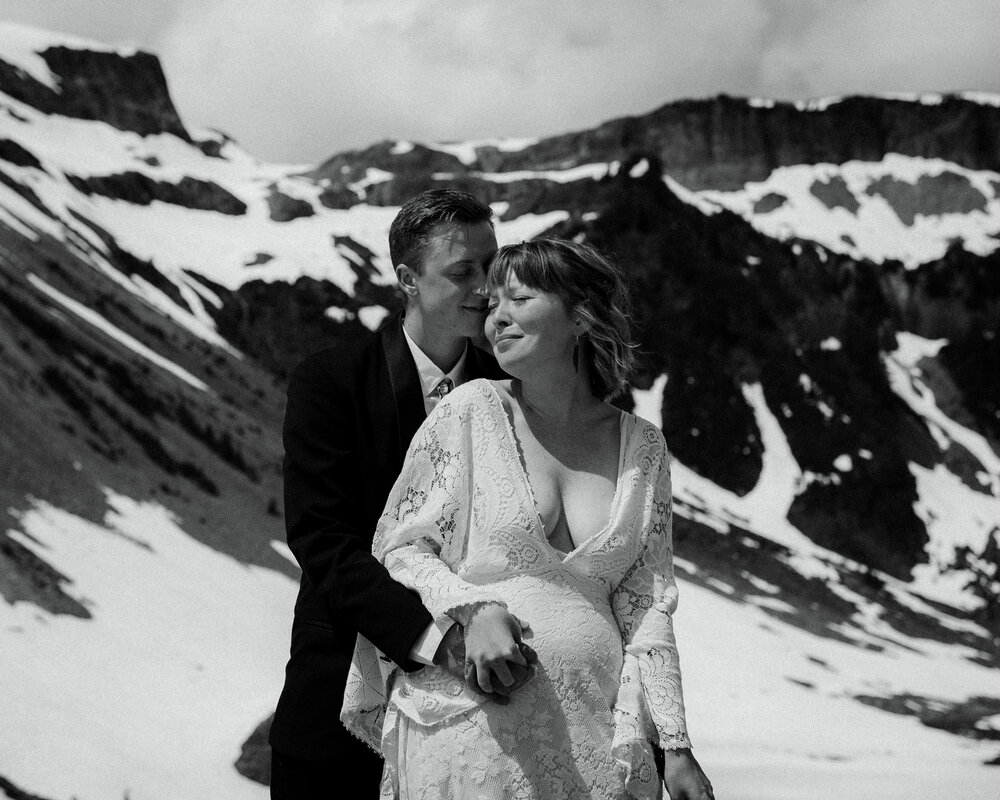 A bride and groom get married at Mt. Baker in a snowy summer elopement ceremony