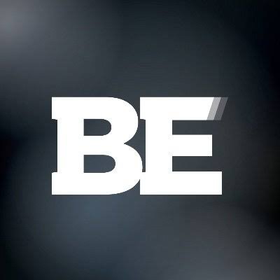 Close-up of the word 'BE' in bold white font on a dark background.
