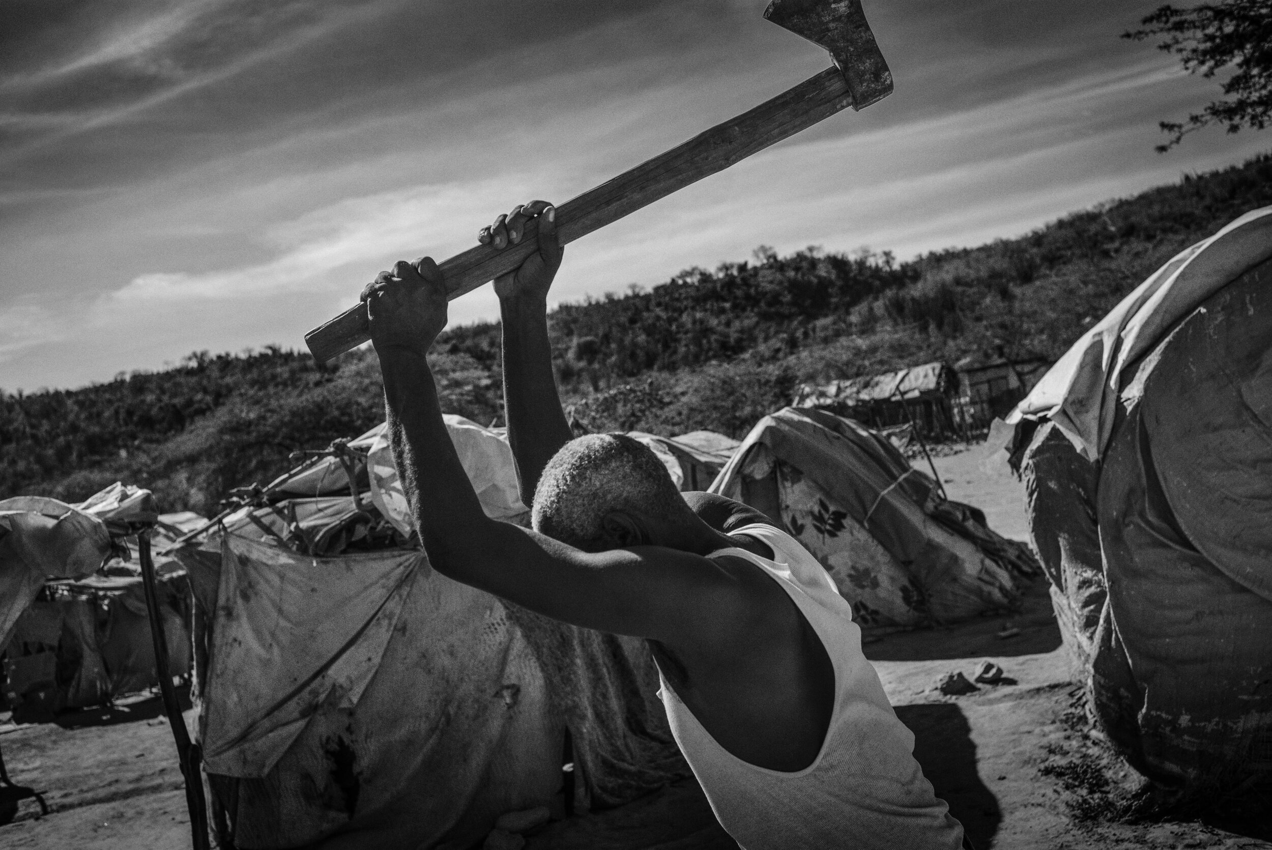  Photo of man swinging an axe 