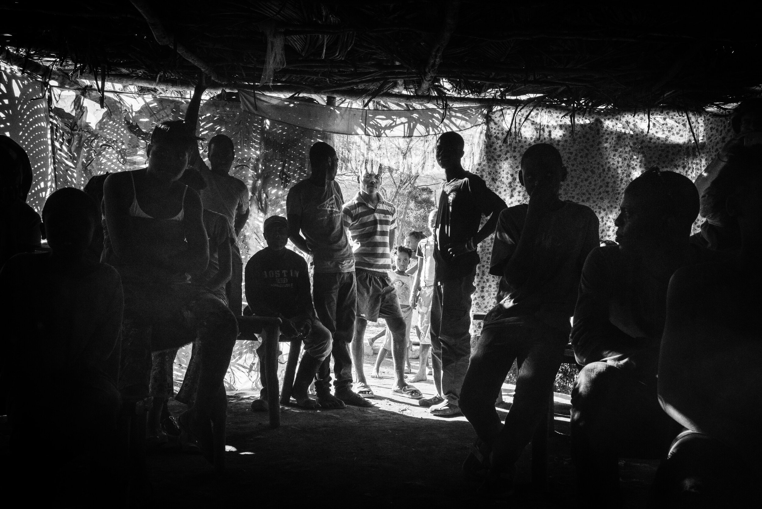  Photo of a crowd of people inside a makeshift church 