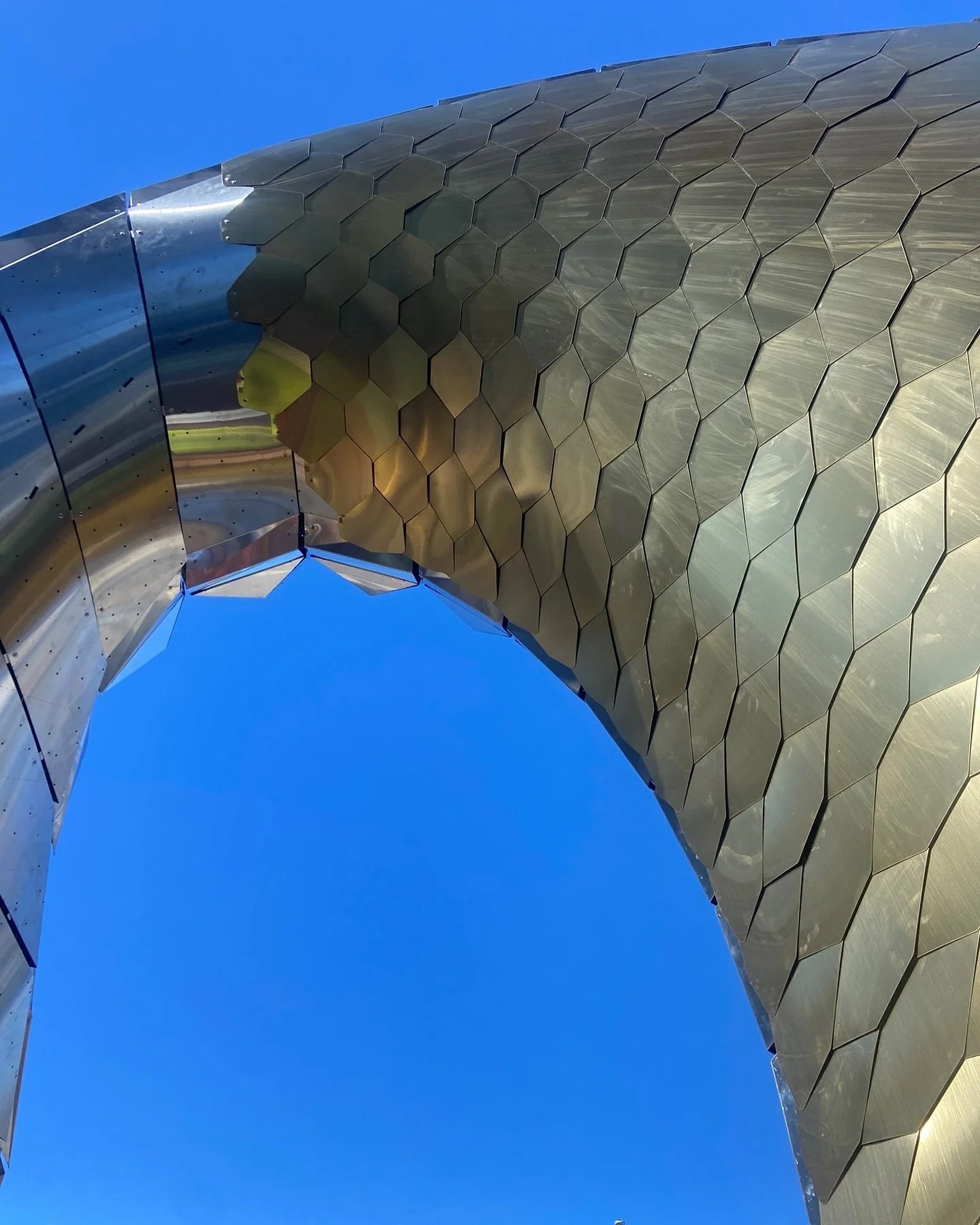 The golden skin! #shinglestyle Photos of the sculpture&rsquo;s inner shingles being installed one by one by the team. As you move around the artwork I love all of the unexpected caustic effects and reflections of the site and sky. Everything is comin