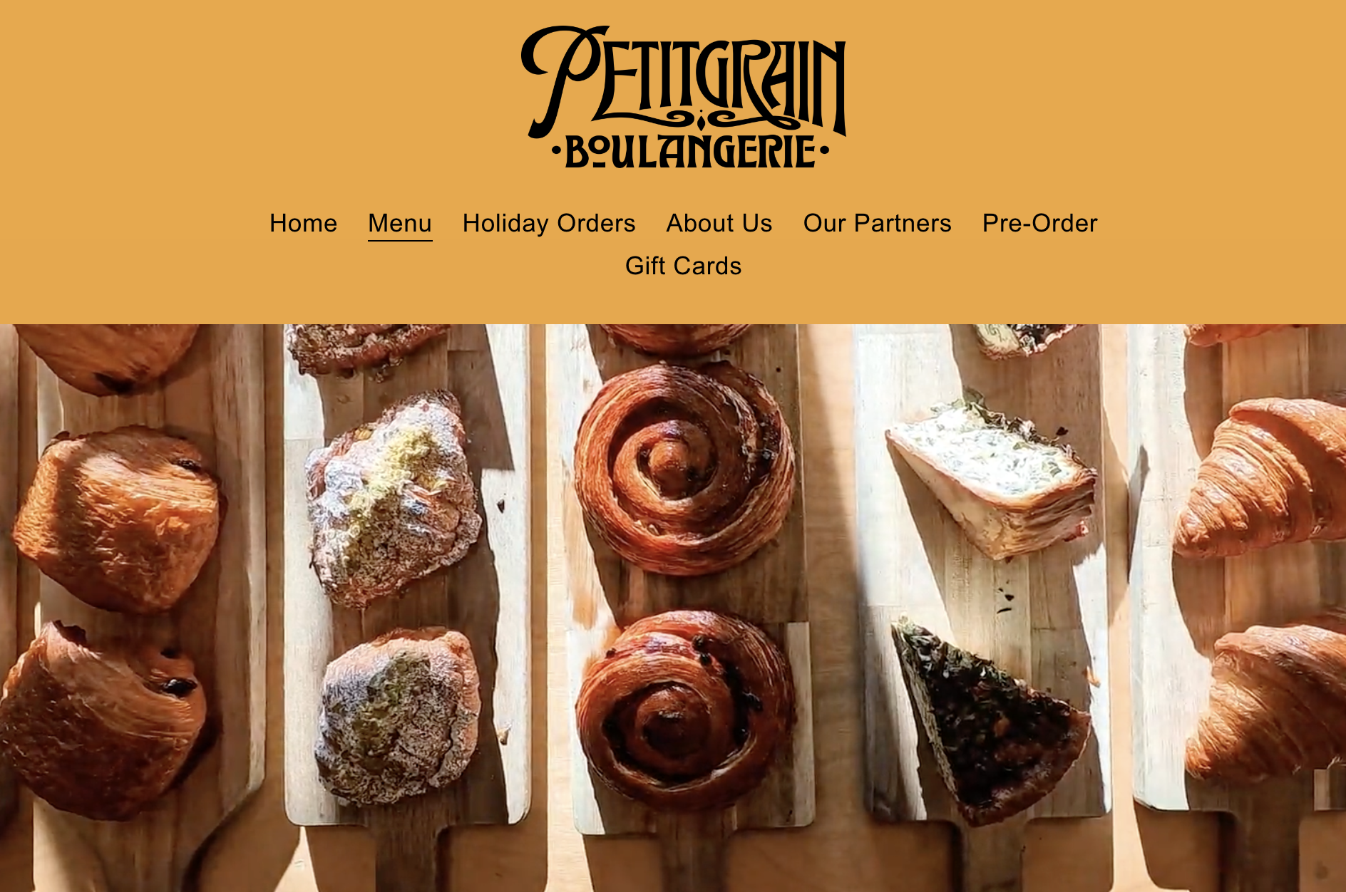 Screenshot of petitgrain boulangerie's website with rows of pastries.