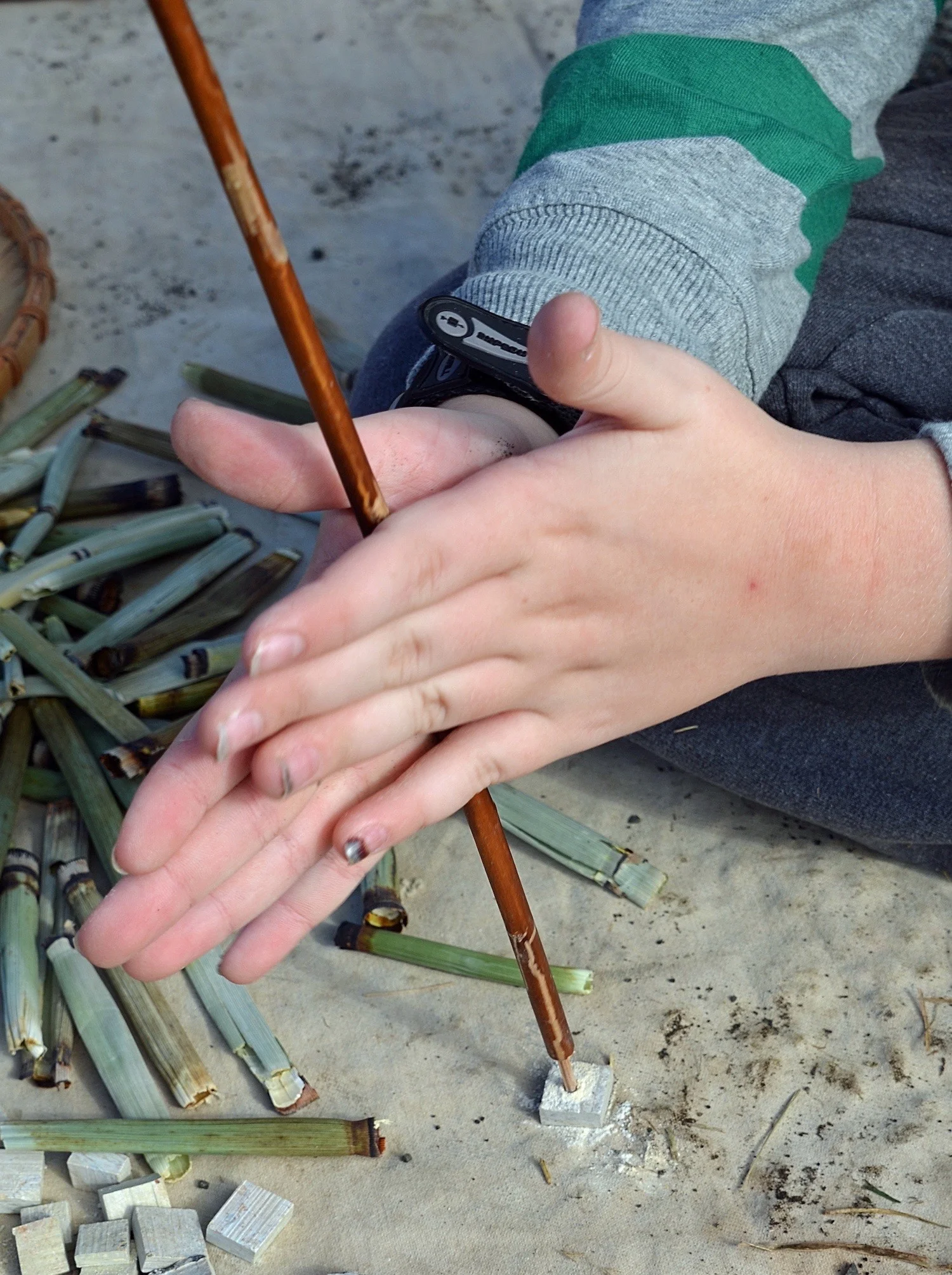 Drilling hole in piece of soapstone using bamboo tipped willow drill