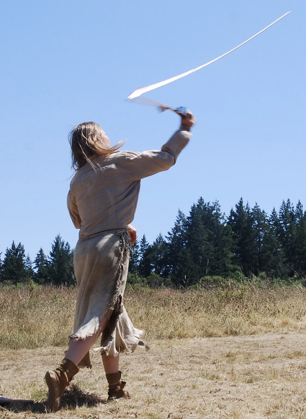 Atlatl in motion. The dart is about to fly away from the thrower.