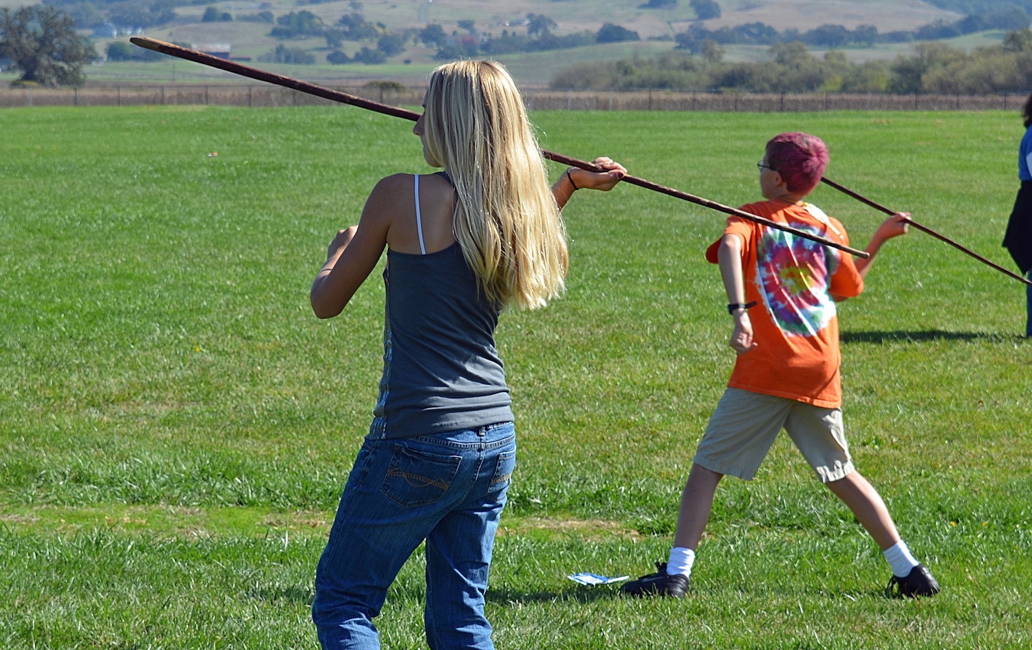 Getting ready to throw handspears at rolling hoops.