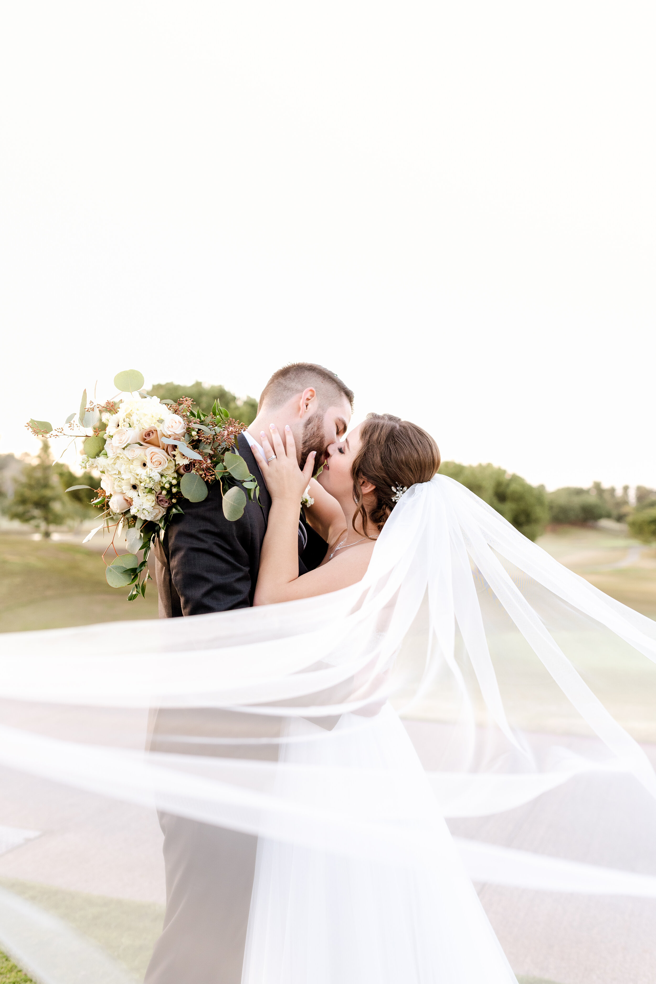 Ravynn and Jordan beneath her veil