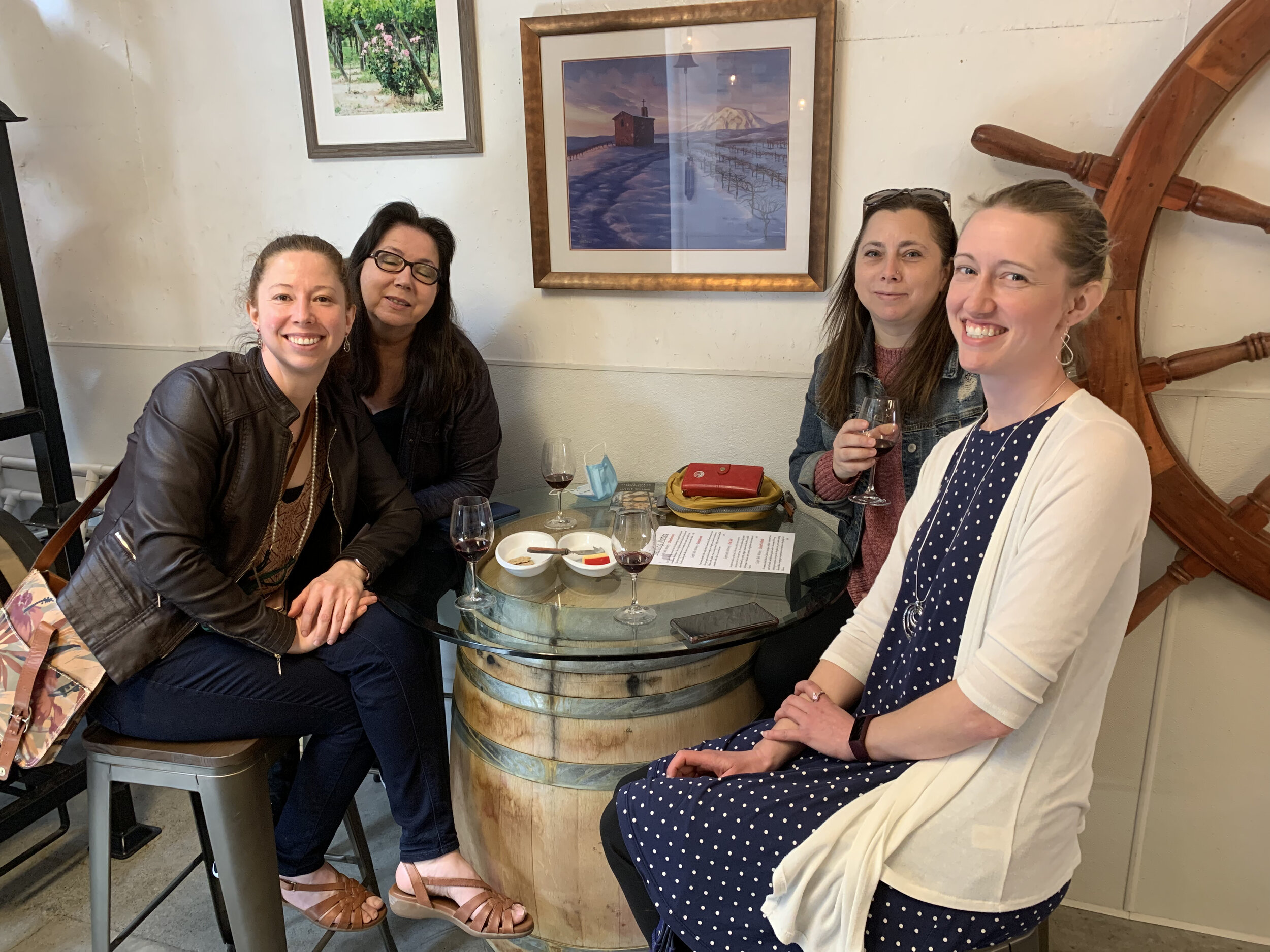 A group of people enjoying a wine flight