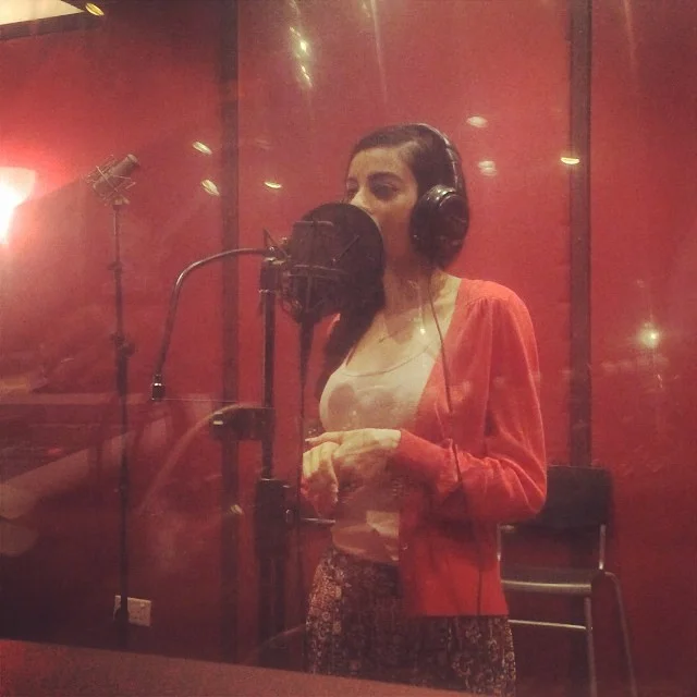  Singing the OST for the film. 