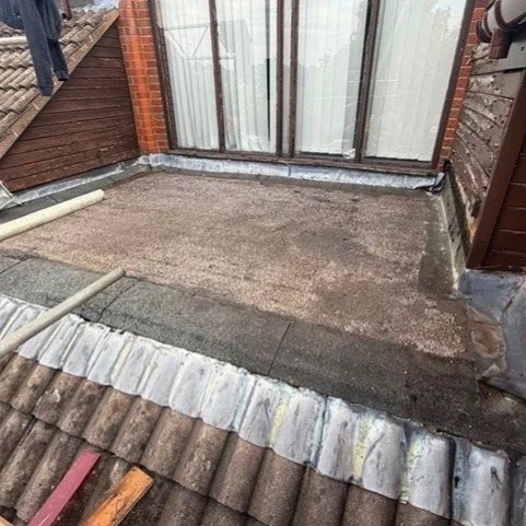 A damaged and rotting old flat roof