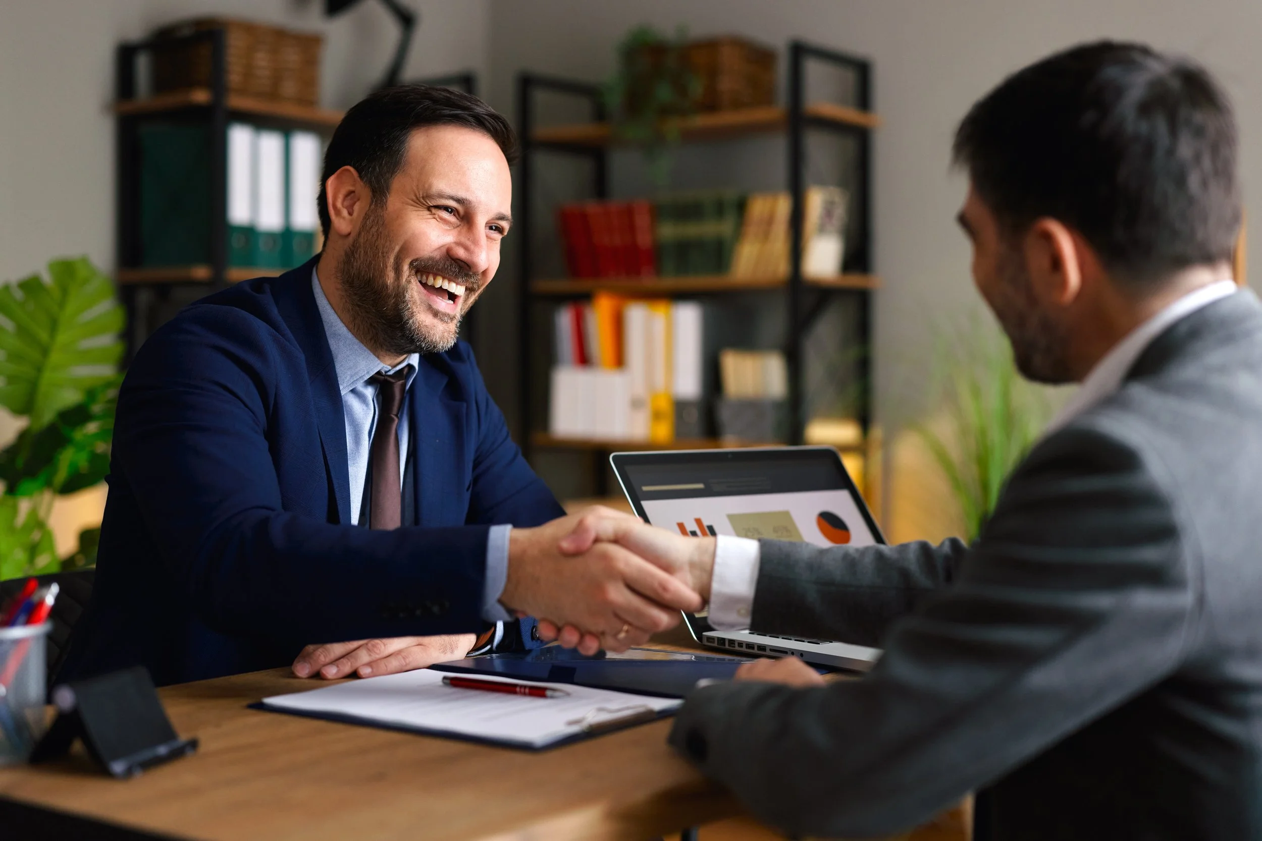Happy handshake between two people